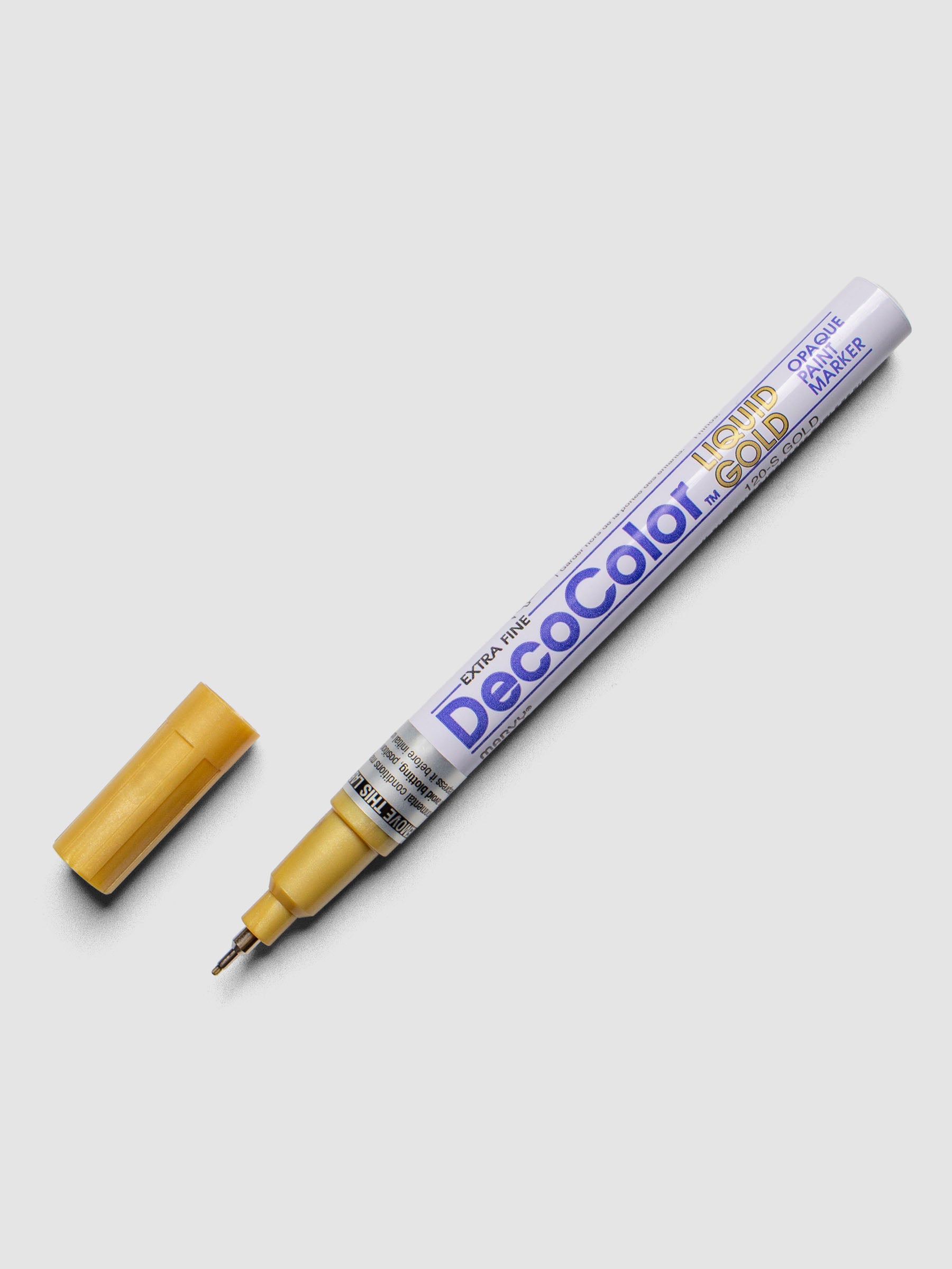 Gold DecoColor paint marker in extra fine shown with cap removed.