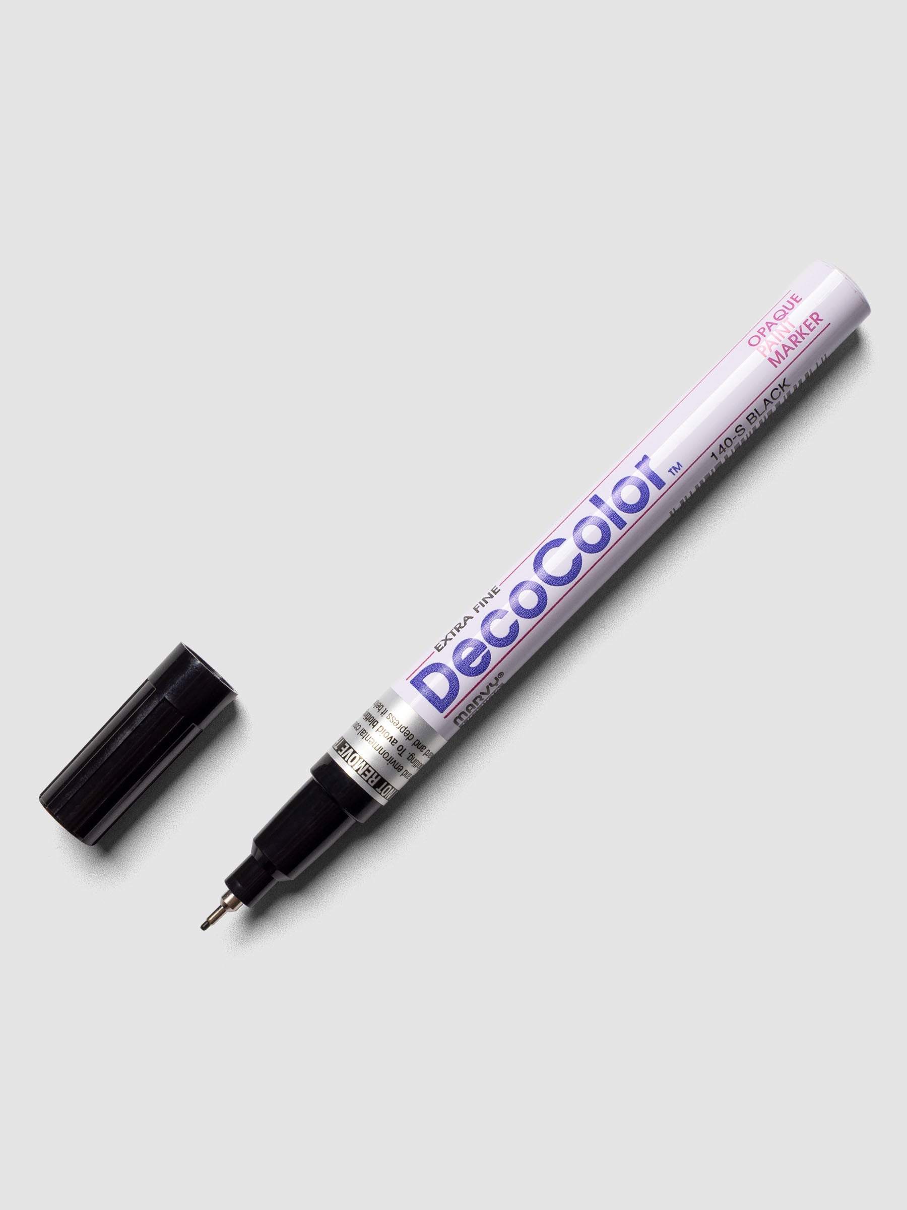 Black DecoColor paint marker in extra fine shown with cap removed.