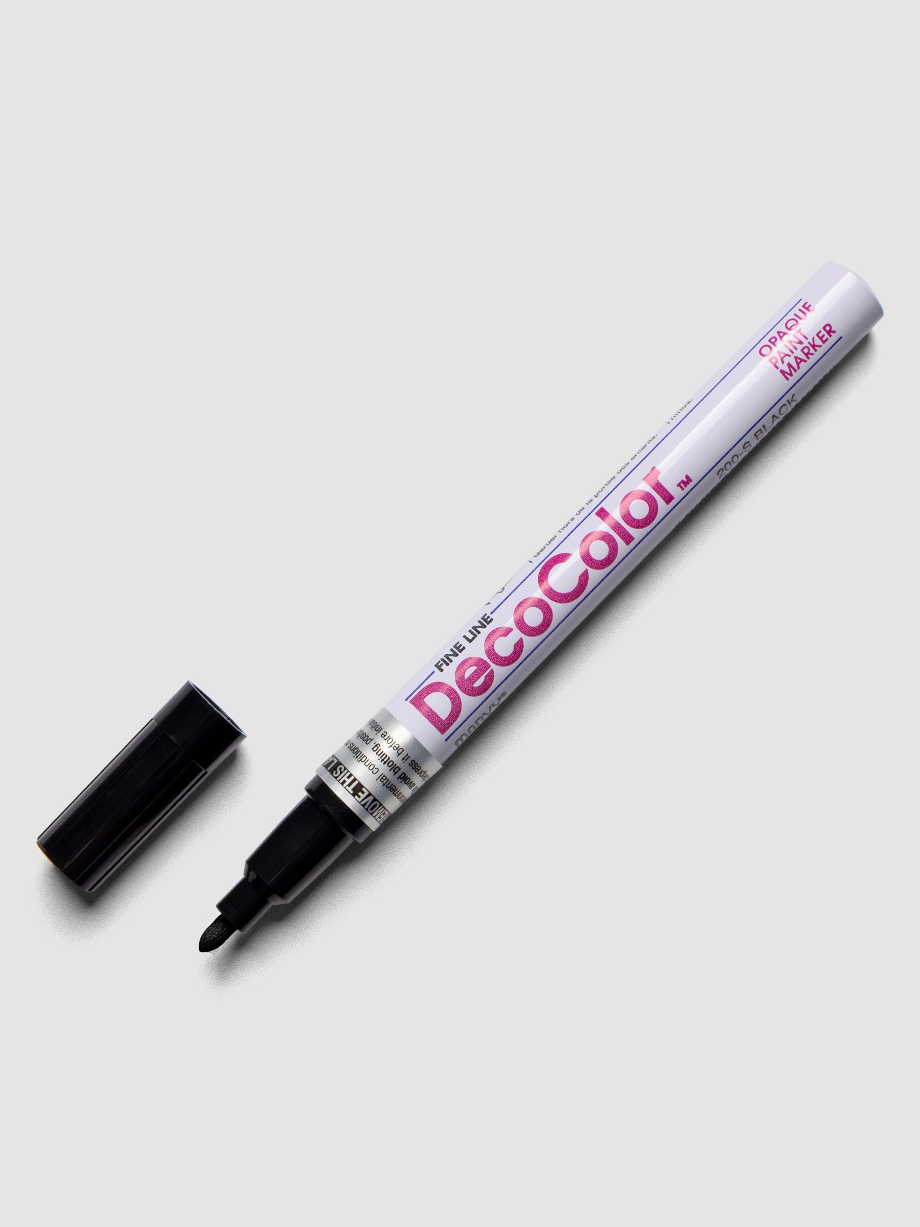 Black DecoColor paint marker in fine shown with cap removed.