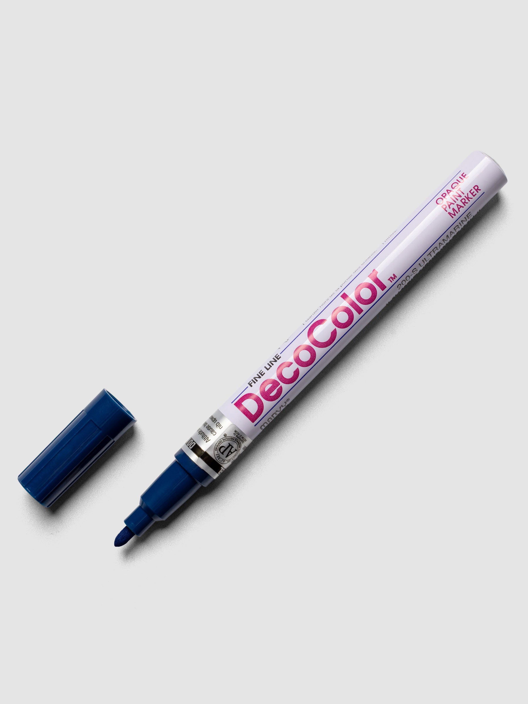 Ultramarine DecoColor paint marker in fine shown with cap removed.