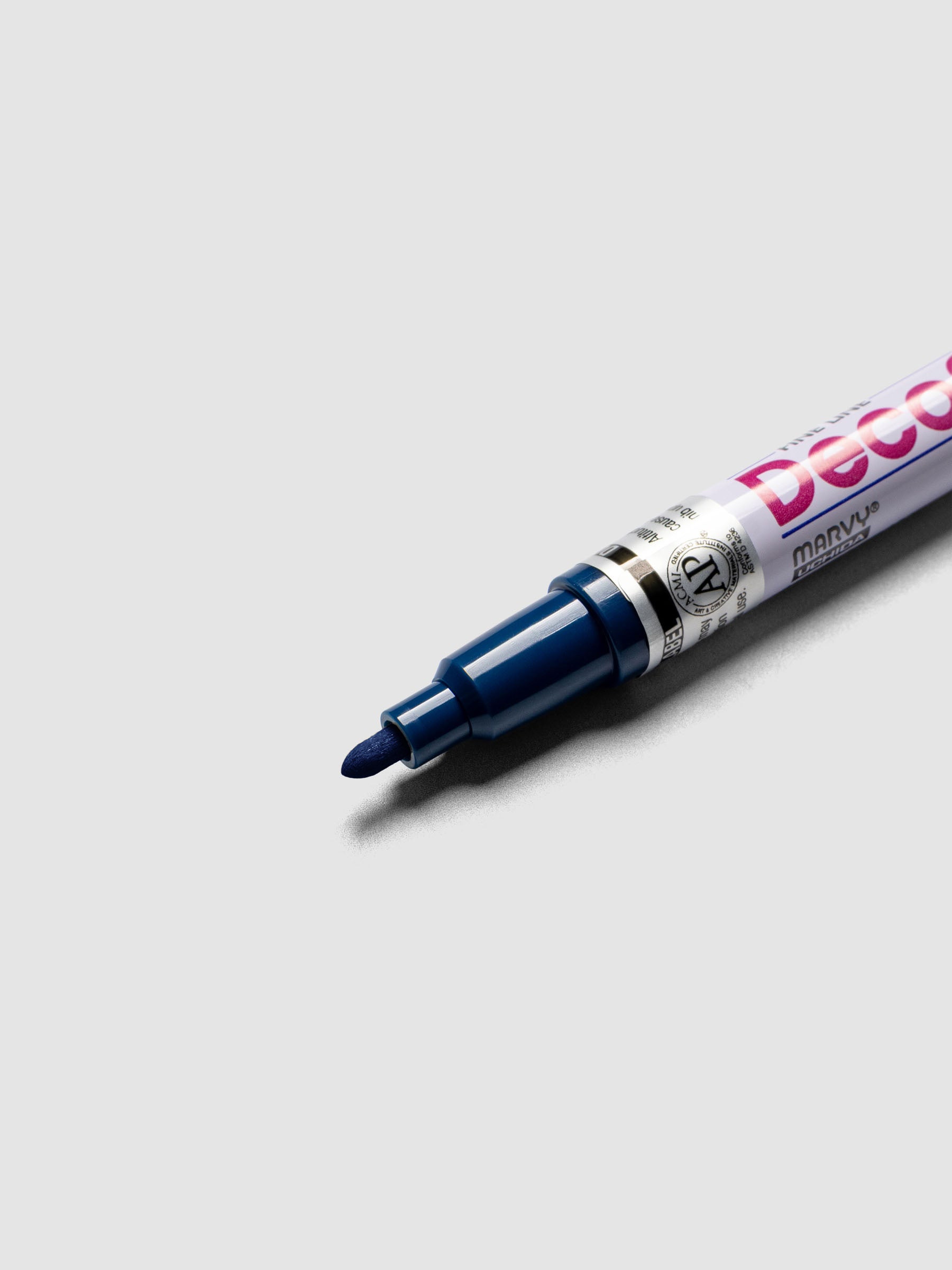 Close up of the Ultramarine DecoColor paint marker in fine showing the nib