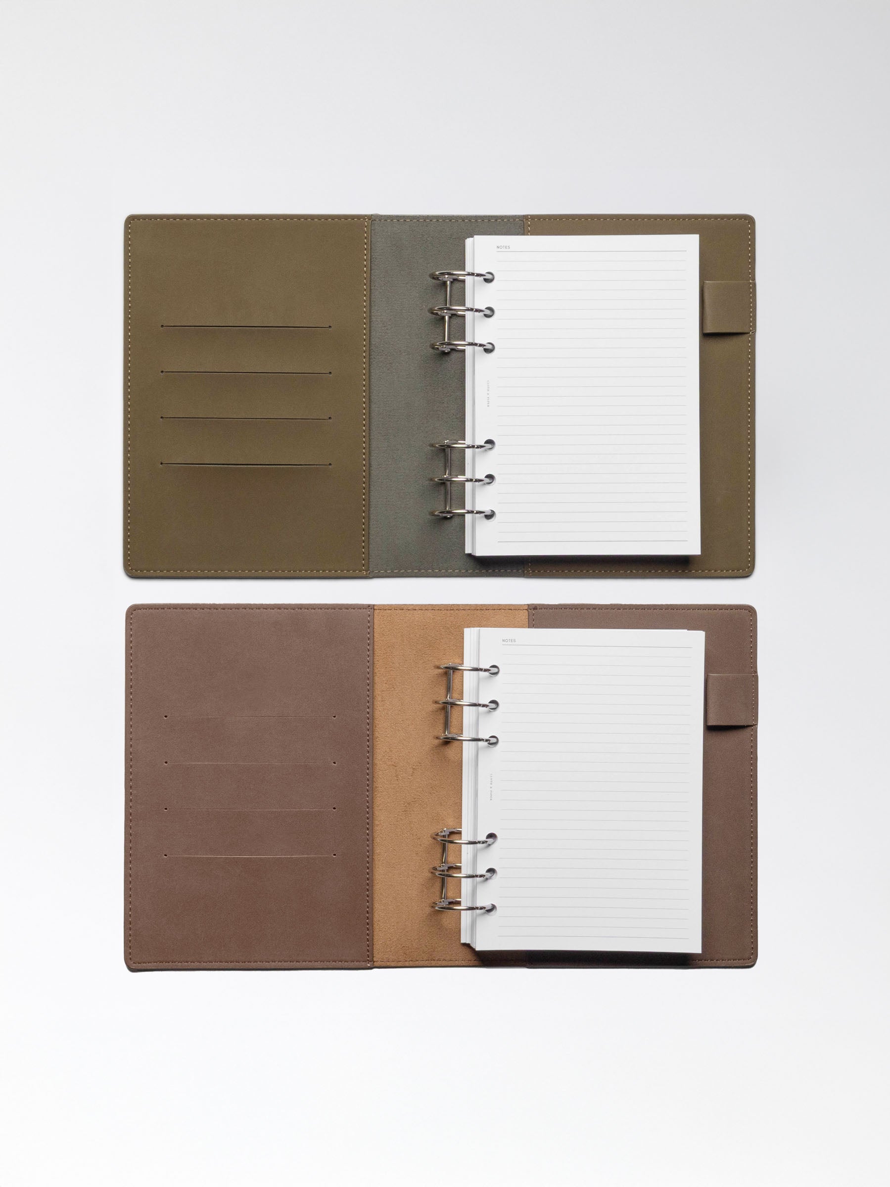 One Cipher and one Espresso folio displayed opened on a neutral background. Planner ring systems are shown in use in each folio.