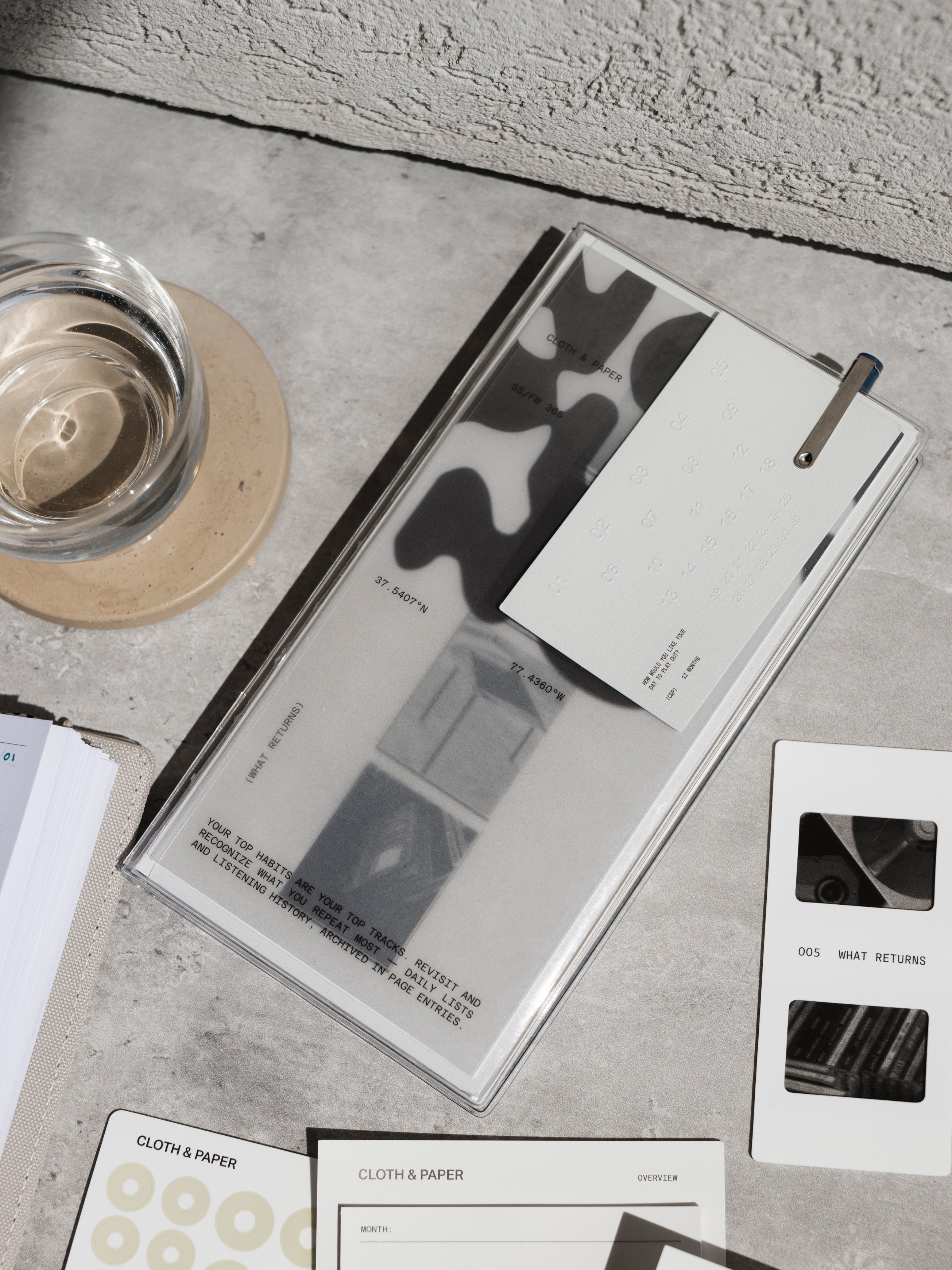 Personal Record Notebook Set, A5 Slim, notebook shown with coordinating products on a concrete background