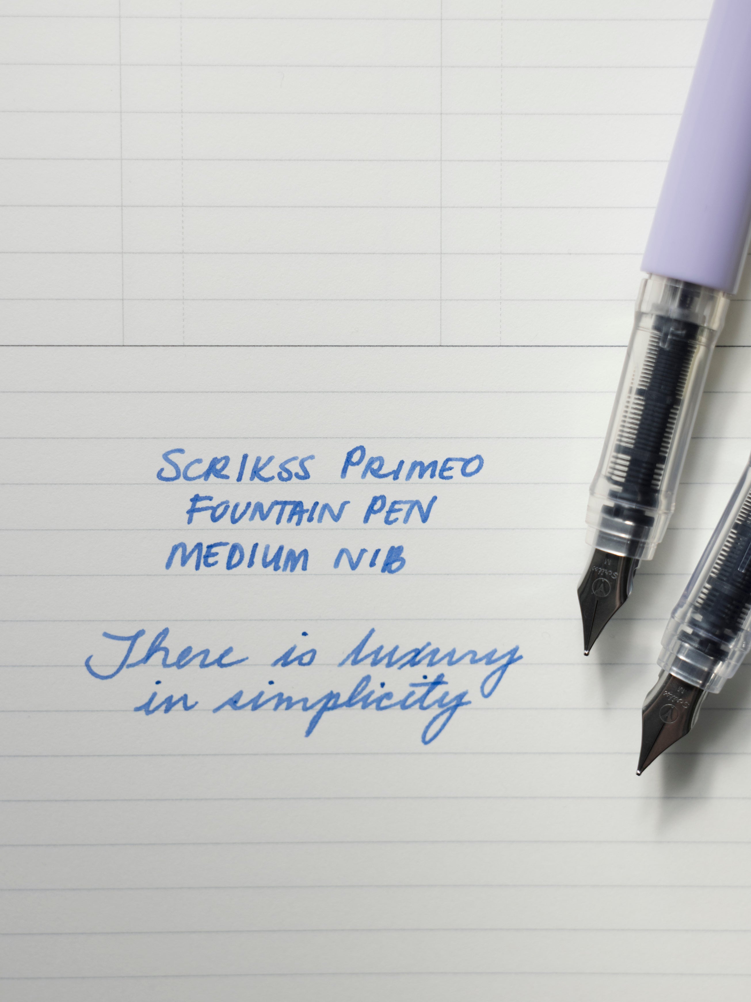 Scrikss Primeo Fountain Pen writing sample on cream paper with blue ink