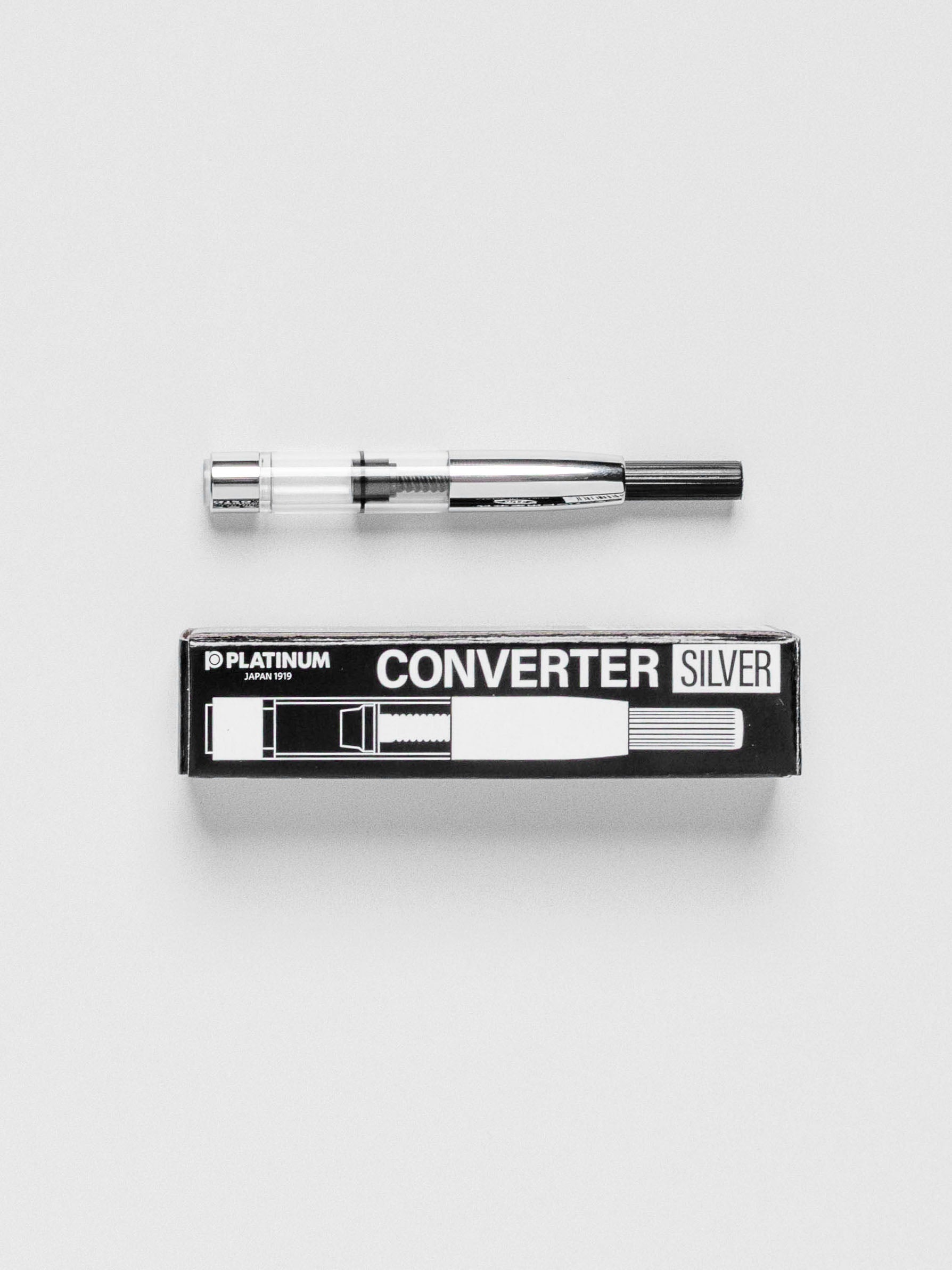 Converter shown with its packaging on a neutral background.