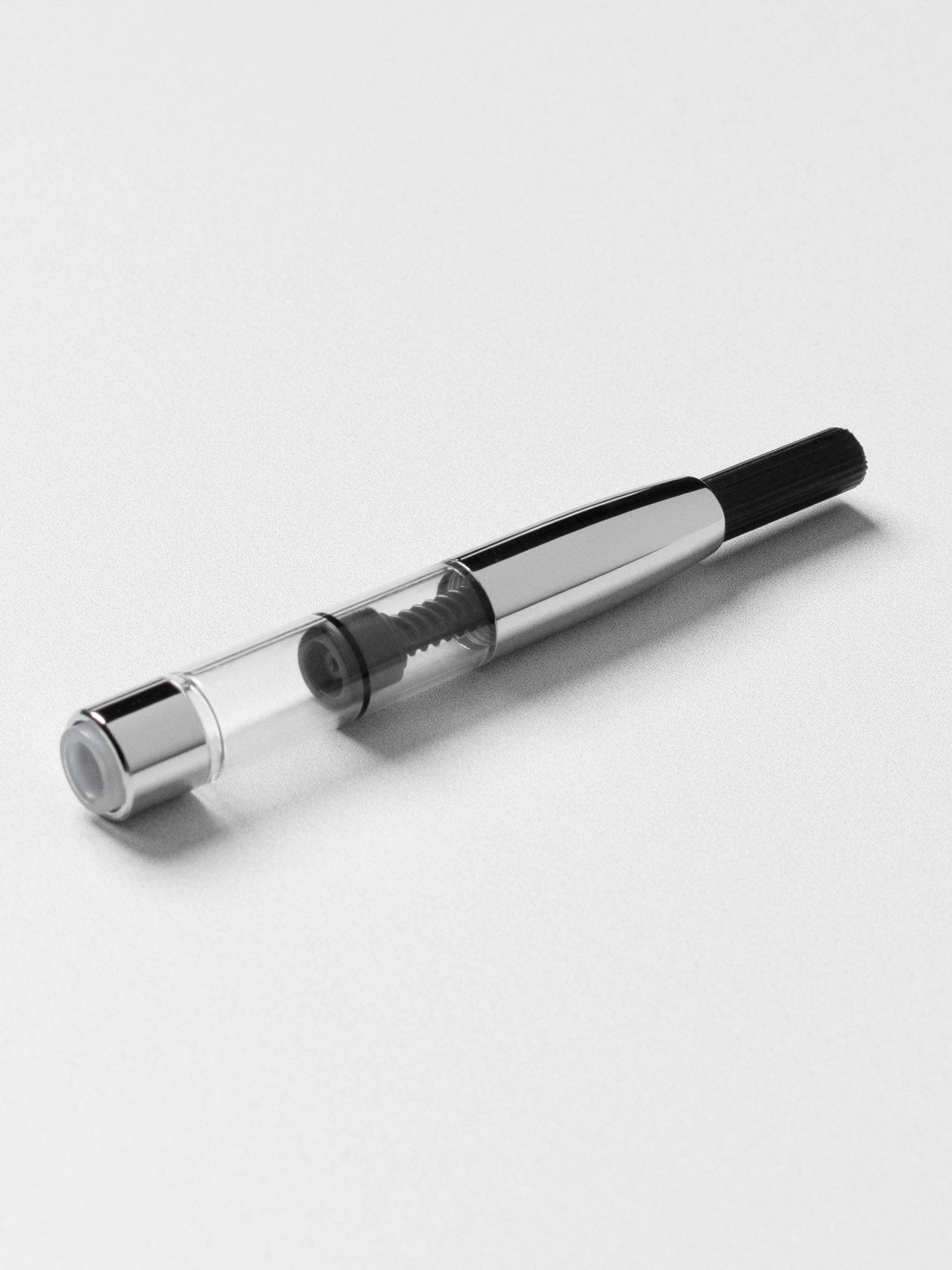 Platinum fountain pen converter displayed on a neutral background.