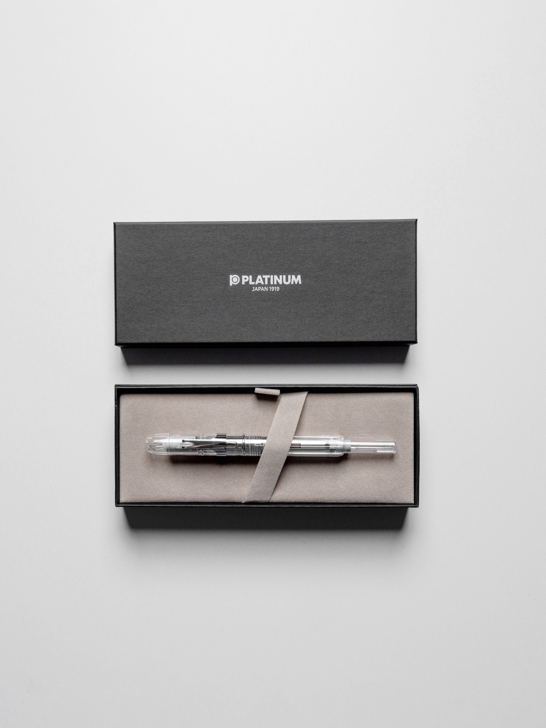 Pen displayed with its packaging on a neutral background.