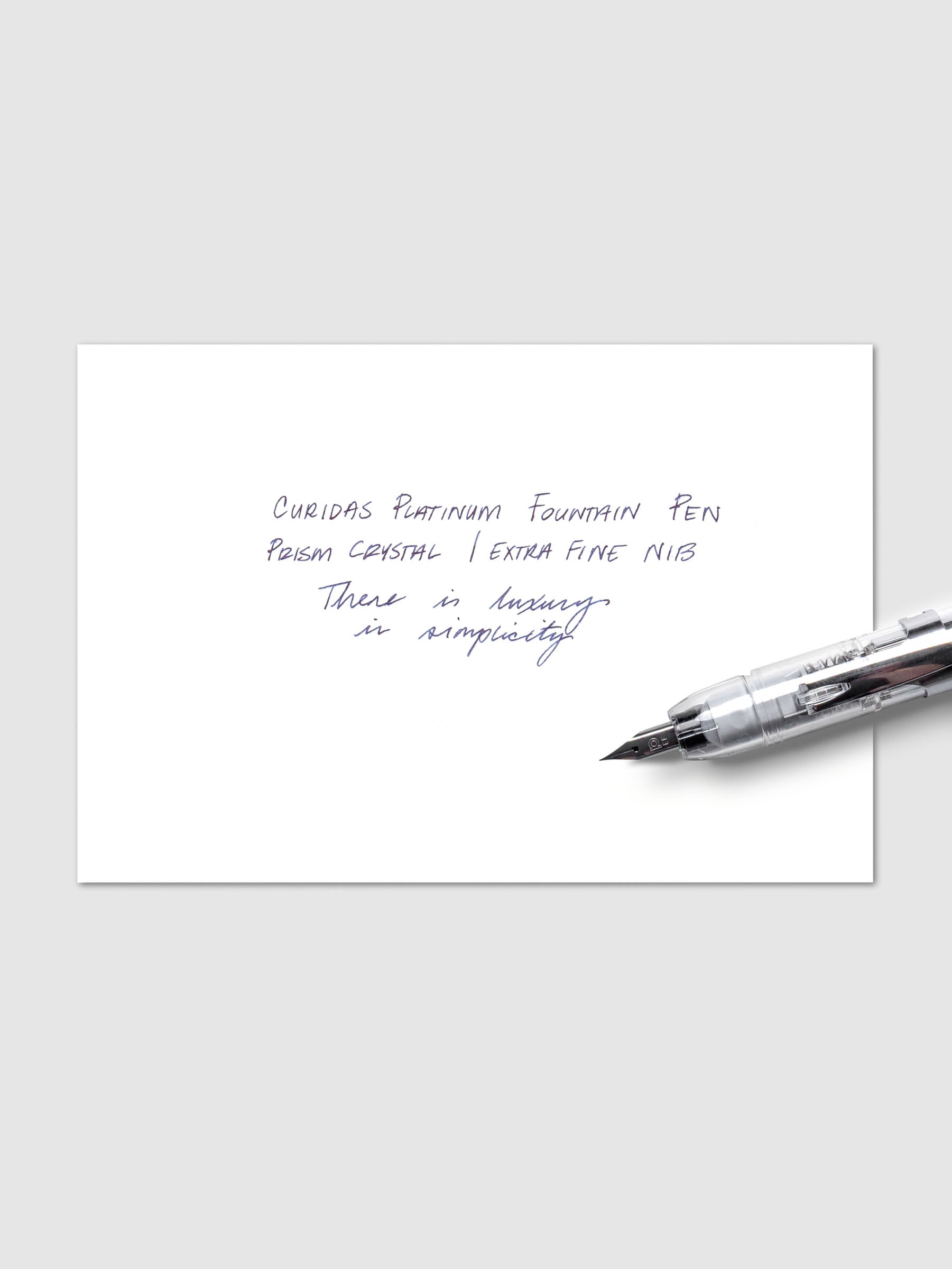 Writing sample sheet shown with Platinum Curidas fountain pen displayed on top of it.
