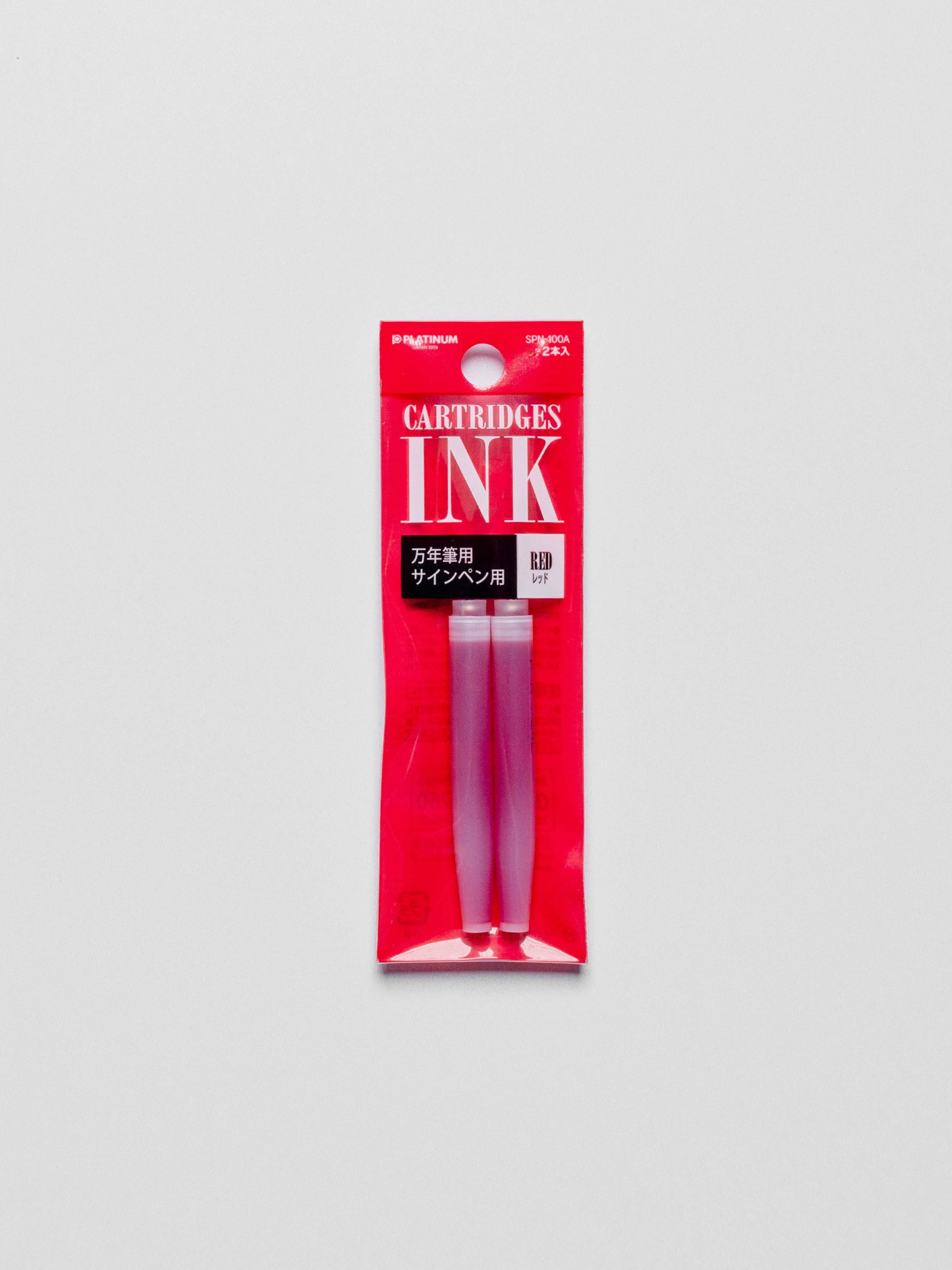 Red ink refill in its packaging displayed on a neutral background.