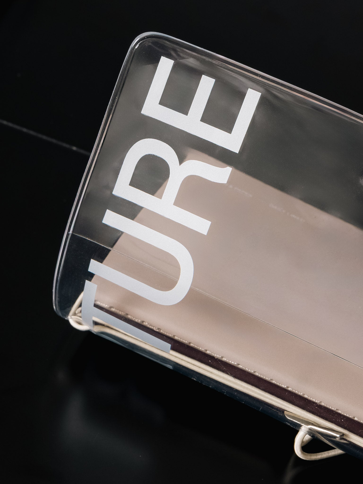 Aperture Travel Notebook Cover | Clear Vinyl on a black table