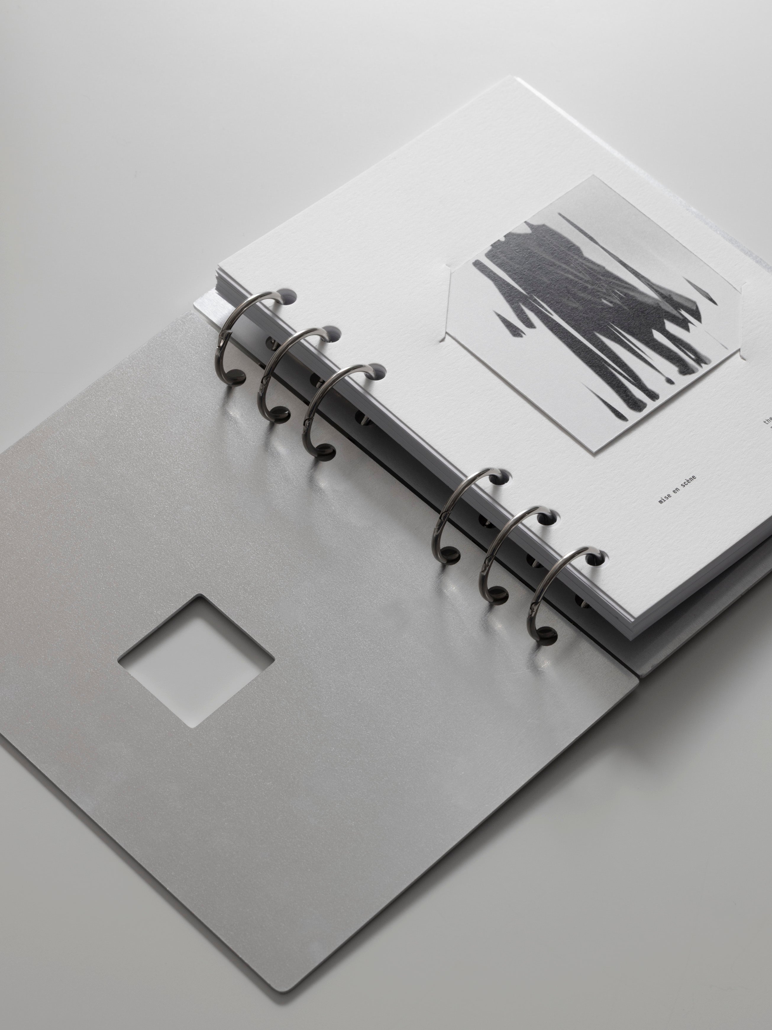 Personal Wide Clad Cover Set open to a mise en scène dashboard insert, shown at an angle against a light gray background