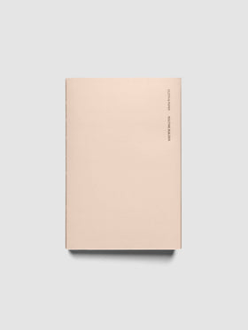 Perfect Bound Notebook | CP Petite | Routine Builder shown closed on a neutral background, plain blush cover