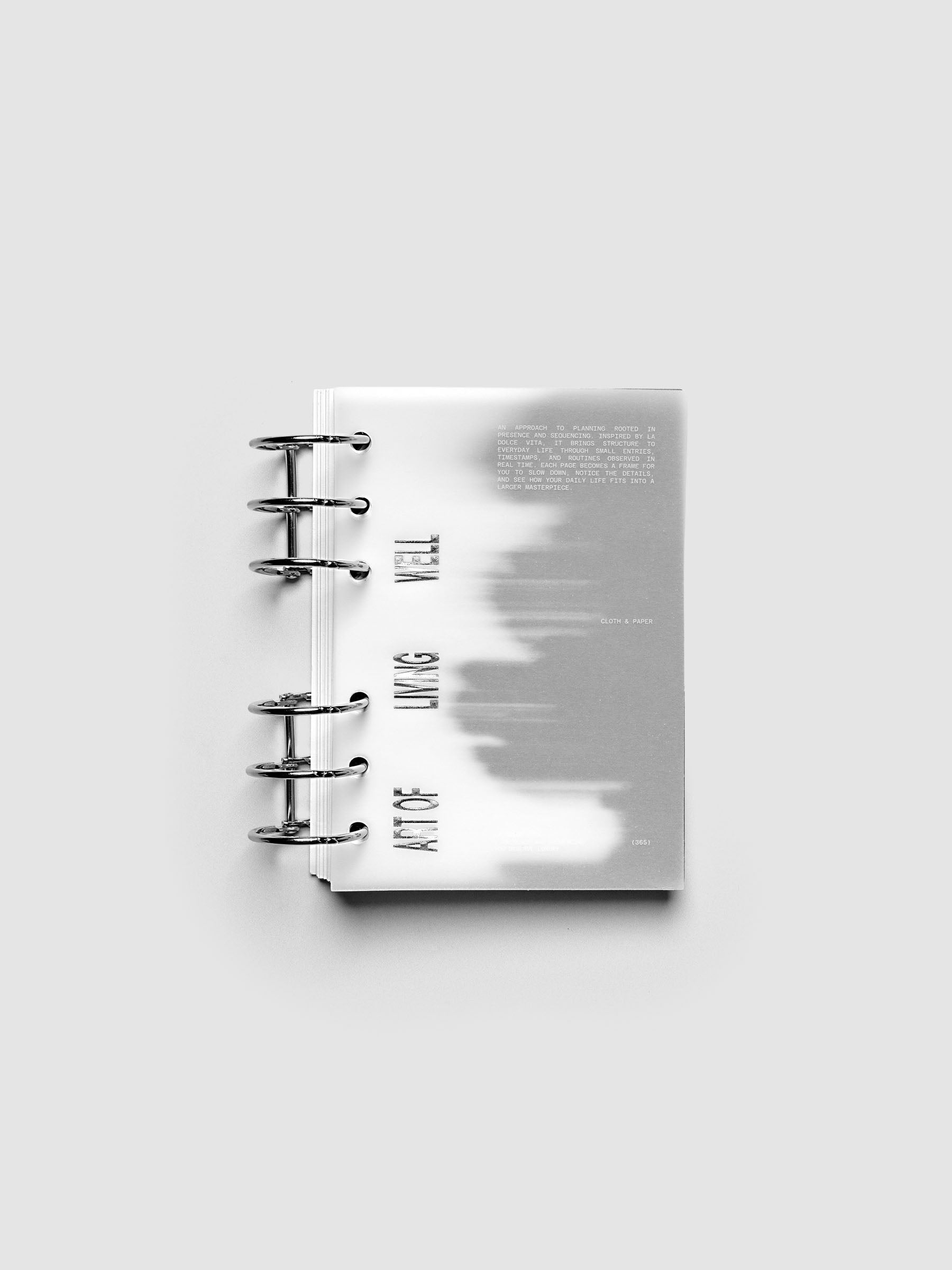 La Dolce Vita Dashboard Duo in A6 6-Ring Punch, a vellum overlay printed in white ink with silver foil layered over a soft gray gradient cardstock base on a light gray background