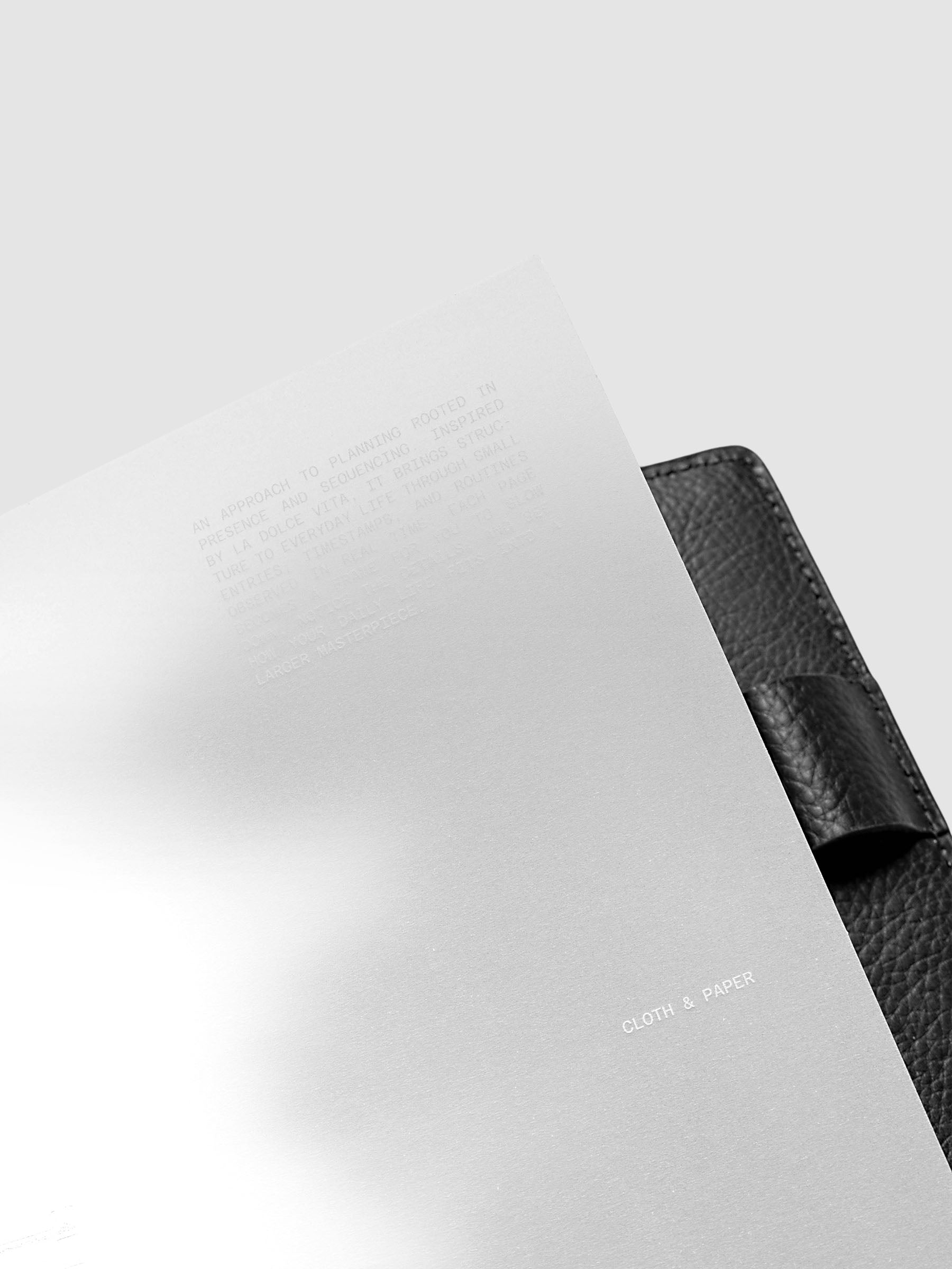 La Dolce Vita Dashboard Duo in Half Letter 8-Disc Punch, a vellum overlay printed in white ink with silver foil layered over a soft gray gradient cardstock base on a light gray background