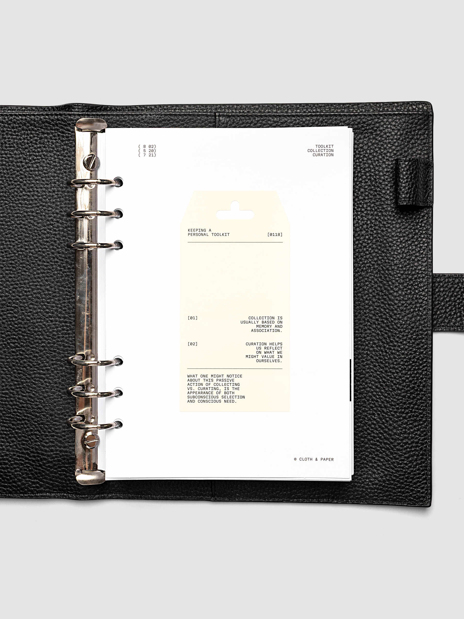Personal Toolkit Planner Dashboard in A5 6-Ring Punch, a cardstock dashboard with an affixed warm gray printed tag in black type on a light gray background
