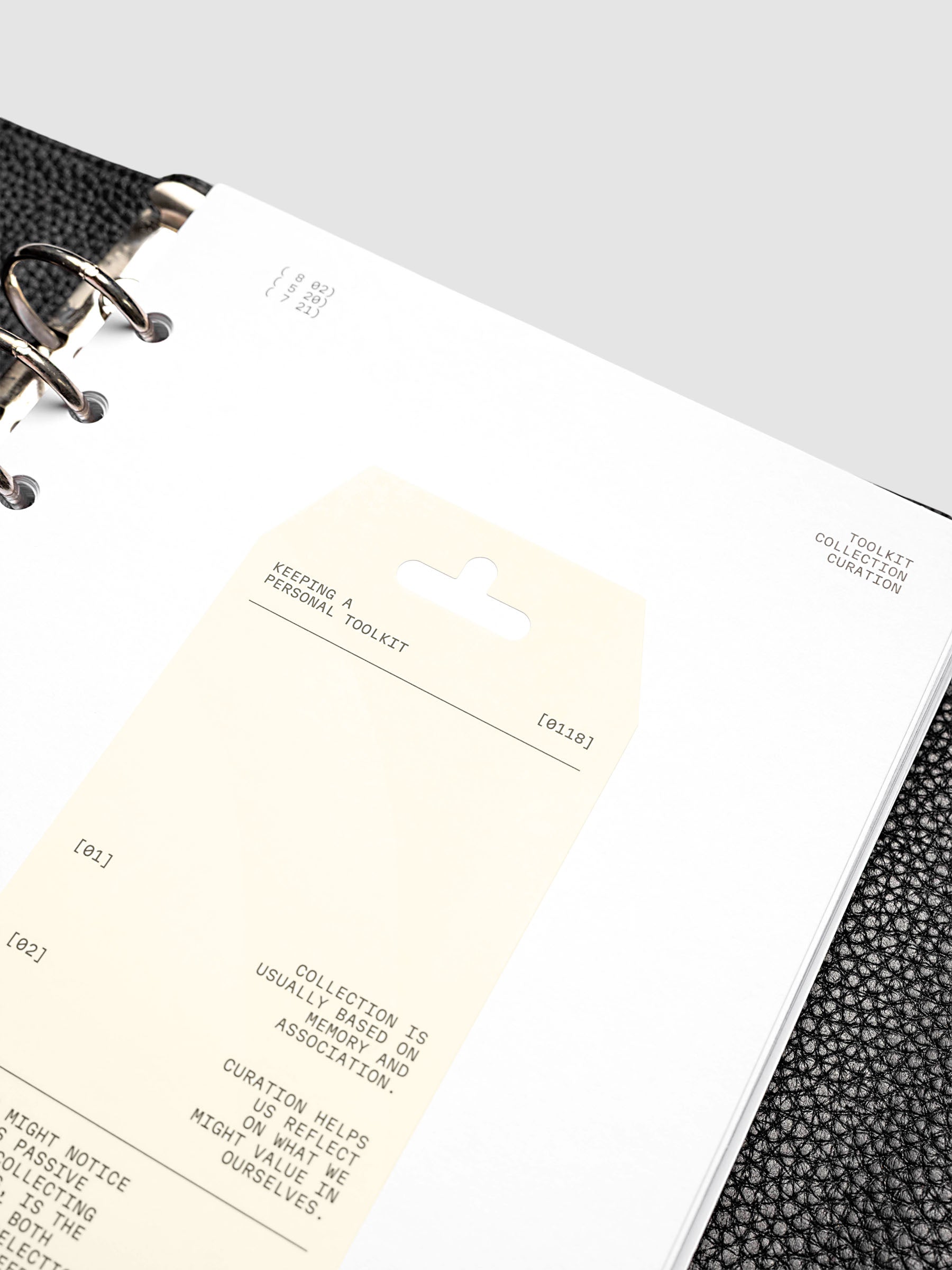 Personal Toolkit Planner Dashboard in A5 6-Ring Punch, a cardstock dashboard with an affixed warm gray printed tag in black type on a light gray background