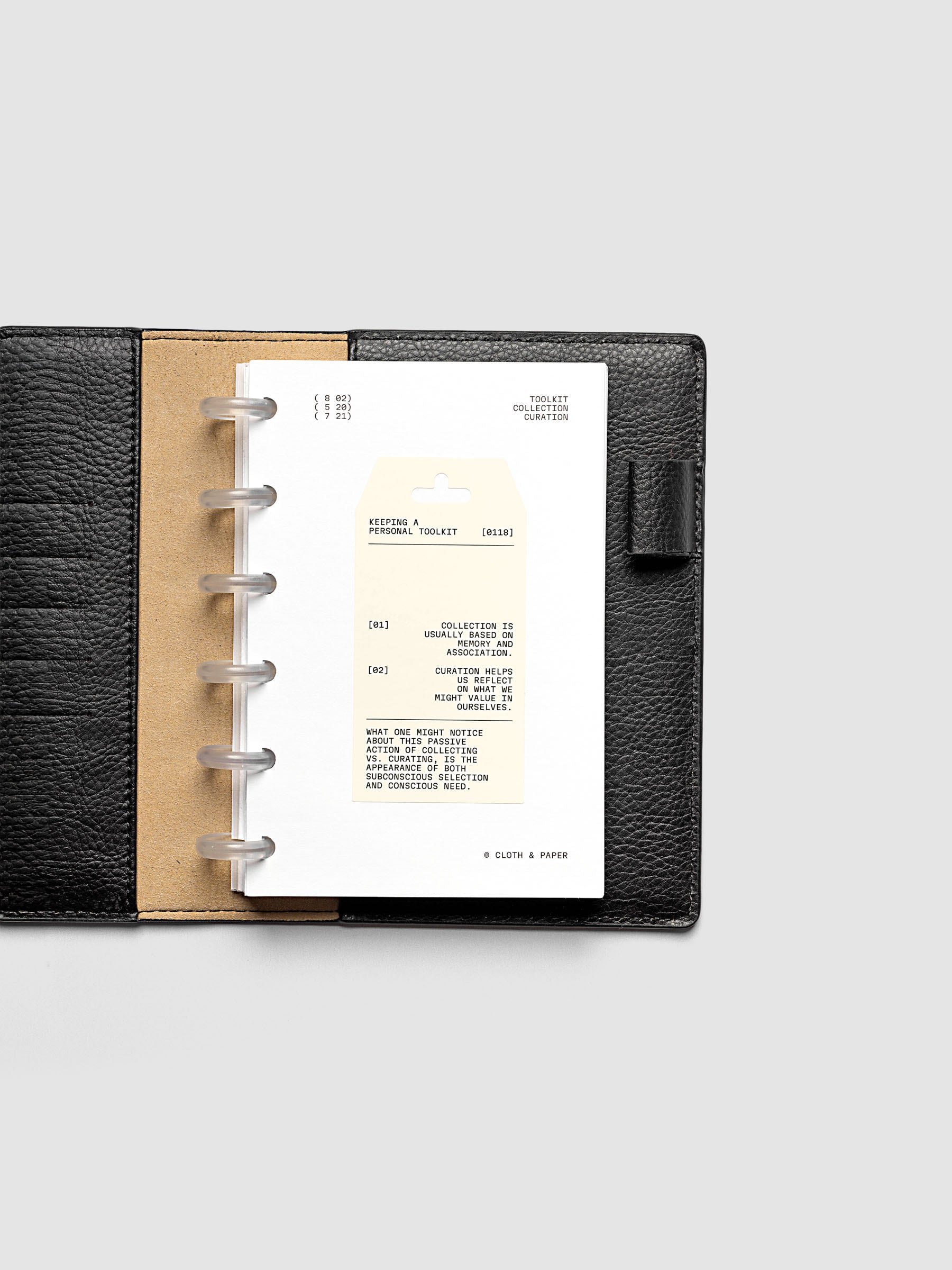 Personal Toolkit Planner Dashboard in CP Petite 6-Disc Punch, a cardstock dashboard with an affixed warm gray printed tag in black type on a light gray background