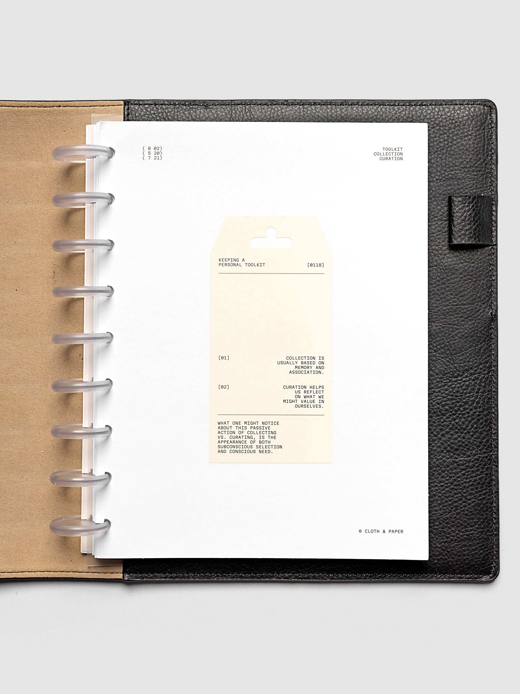 Personal Toolkit Planner Dashboard in HP Classic 9-Disc Punch, a cardstock dashboard with an affixed warm gray printed tag in black type on a light gray background