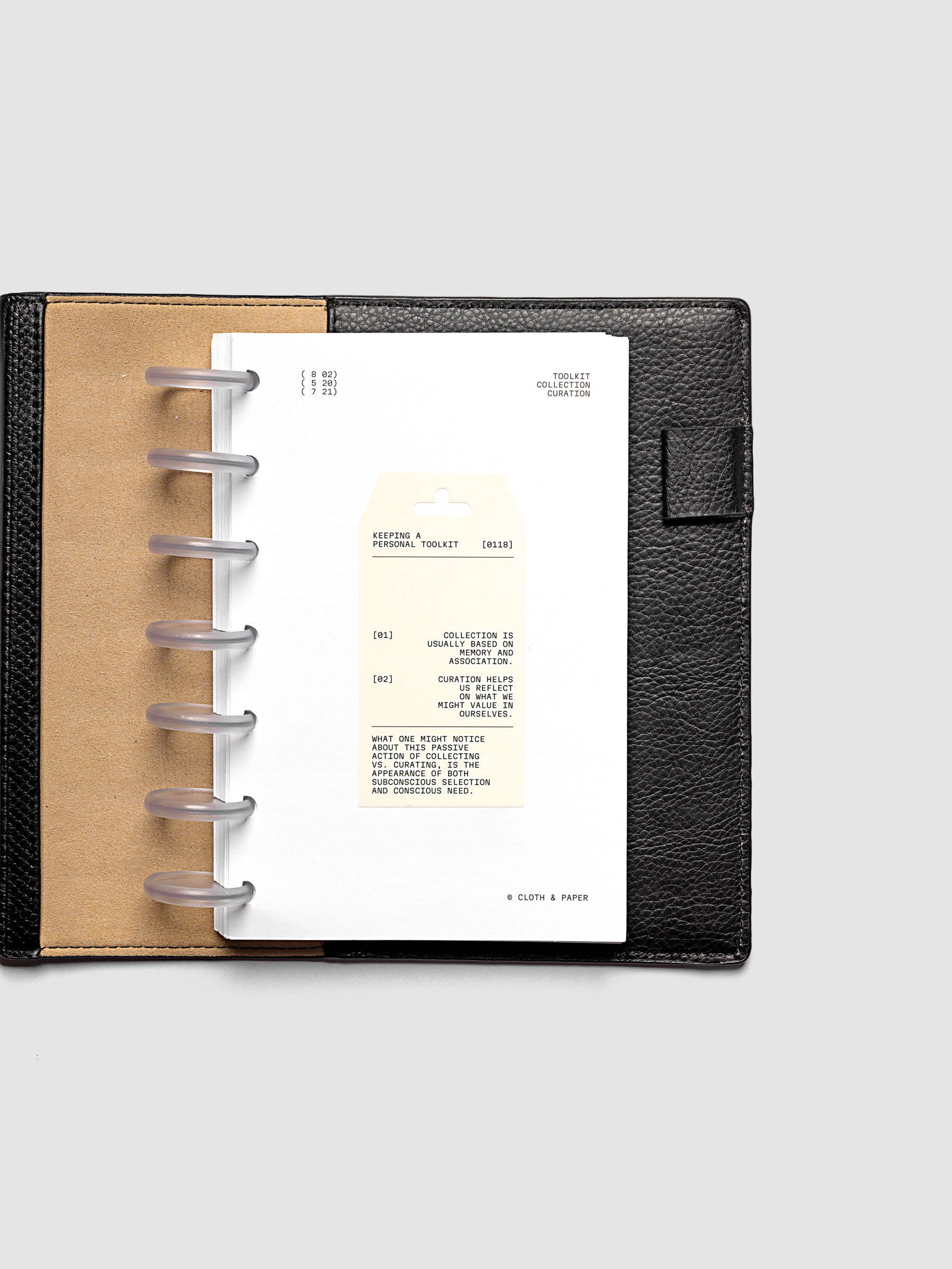Personal Toolkit Planner Dashboard in HP Mini 7-Disc Punch, a cardstock dashboard with an affixed warm gray printed tag in black type on a light gray background