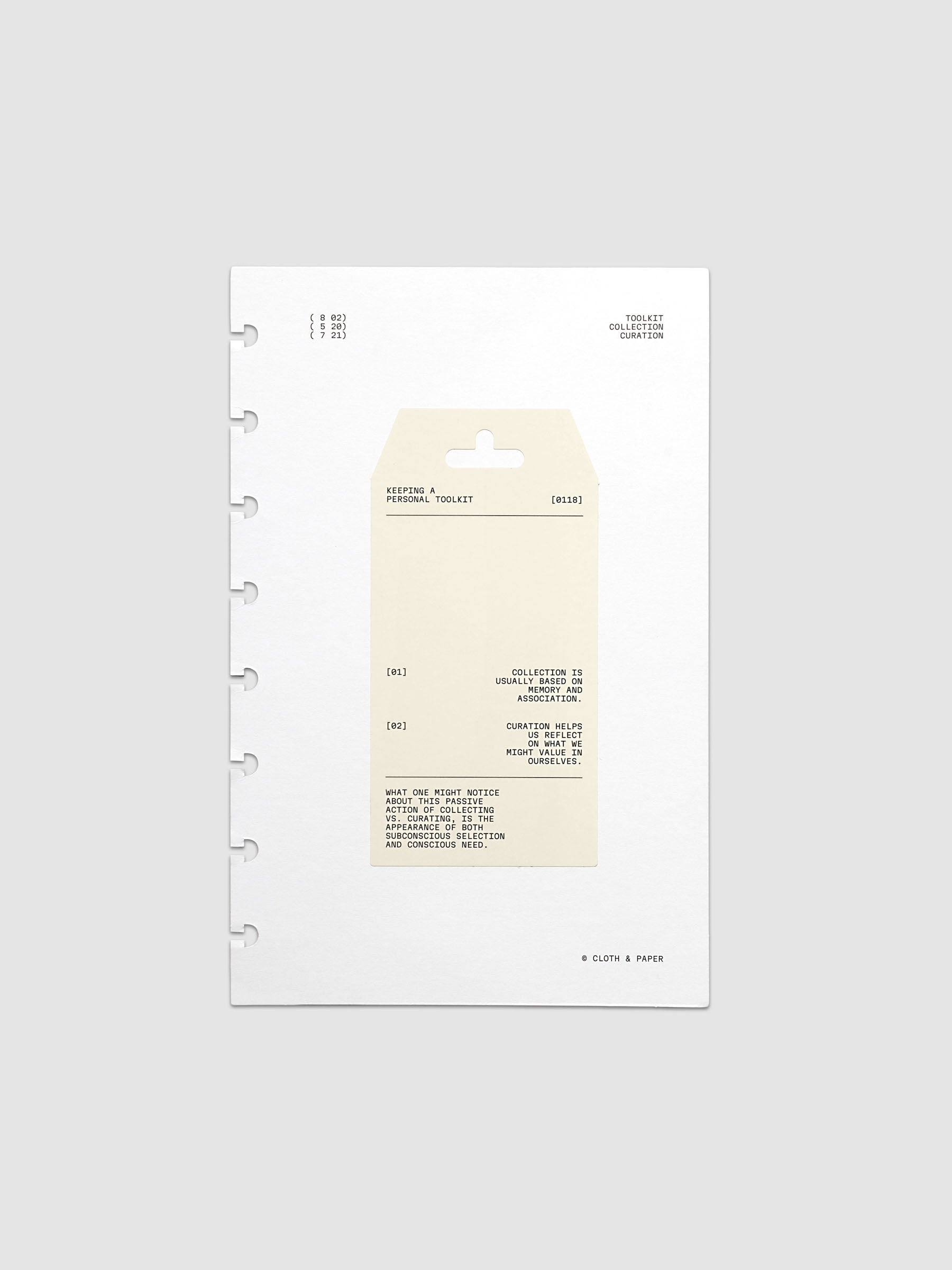 Personal Toolkit Planner Dashboard in Half Letter 8-Disc Punch, a cardstock dashboard with an affixed warm gray printed tag in black type on a light gray background