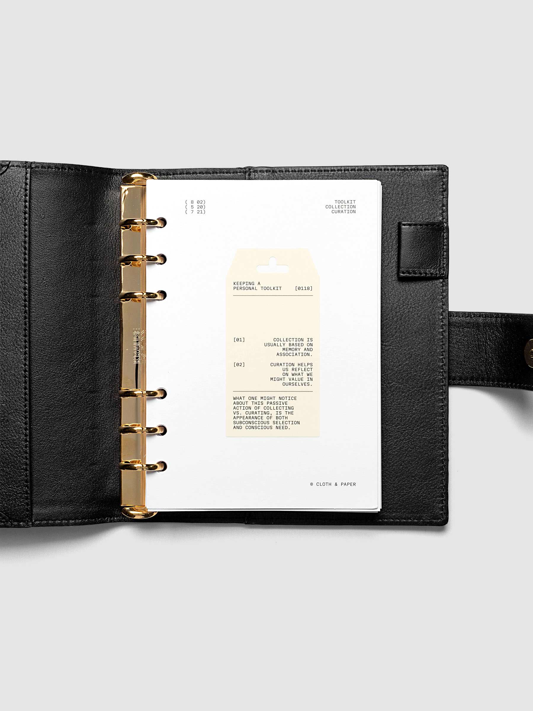 Personal Toolkit Planner Dashboard in Personal Wide 6-Ring Punch, a cardstock dashboard with an affixed warm gray printed tag in black type on a light gray background
