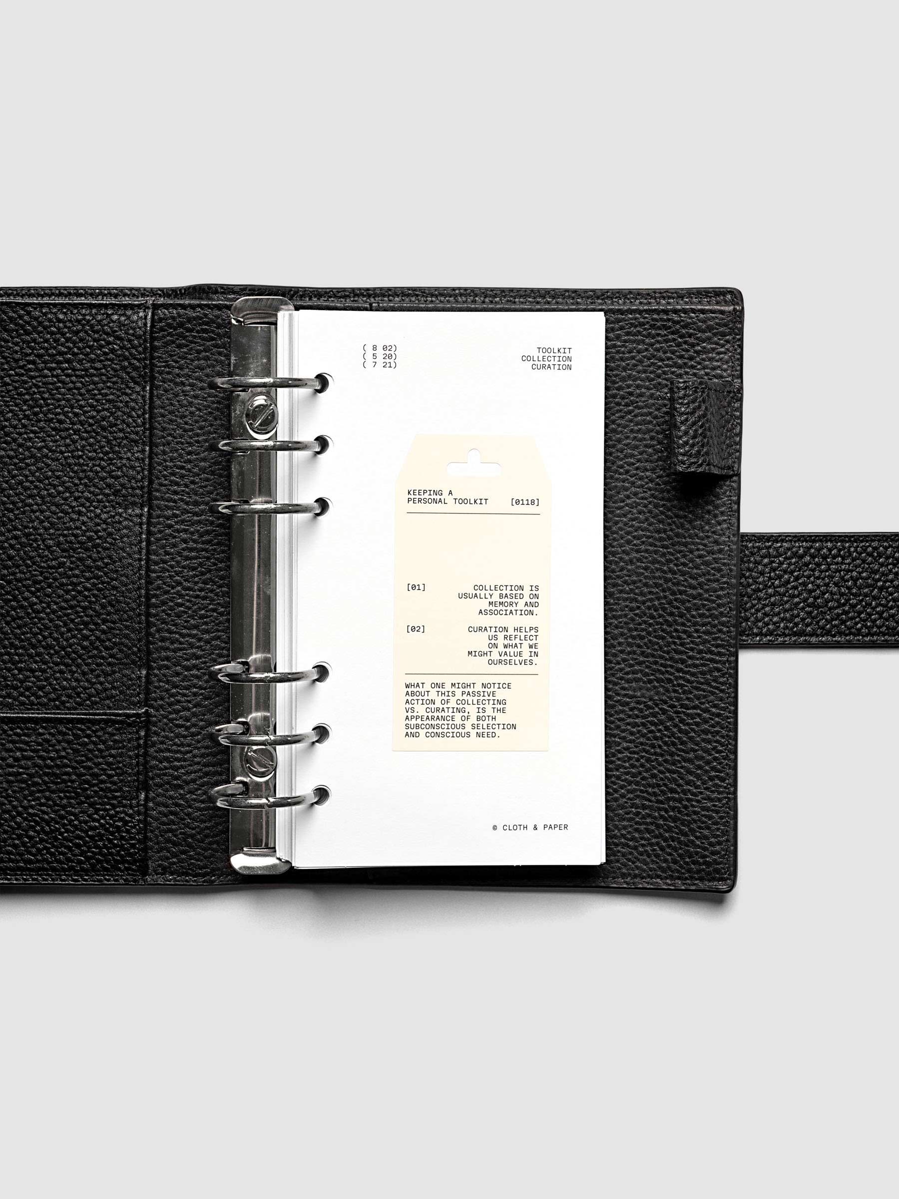 Personal Toolkit Planner Dashboard in Personal 6-Ring Punch, a cardstock dashboard with an affixed warm gray printed tag in black type on a light gray background
