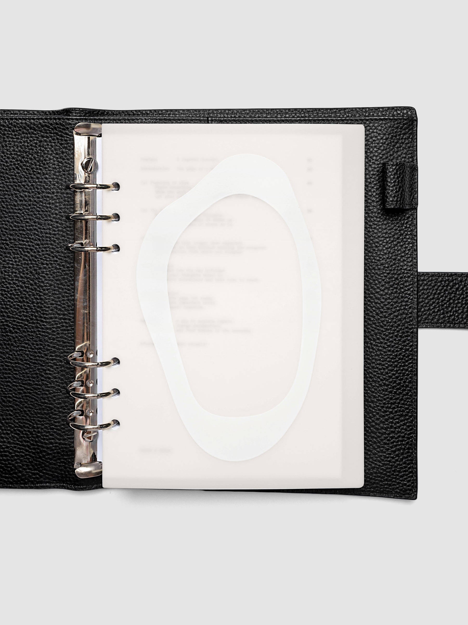 Continuation Planner Cover + Dashboard Set in A5 6-Ring Punch. Milky white frosted plastic cover with a spot gloss organic shape over a black-printed paper dashboard. Image 3 of 5.