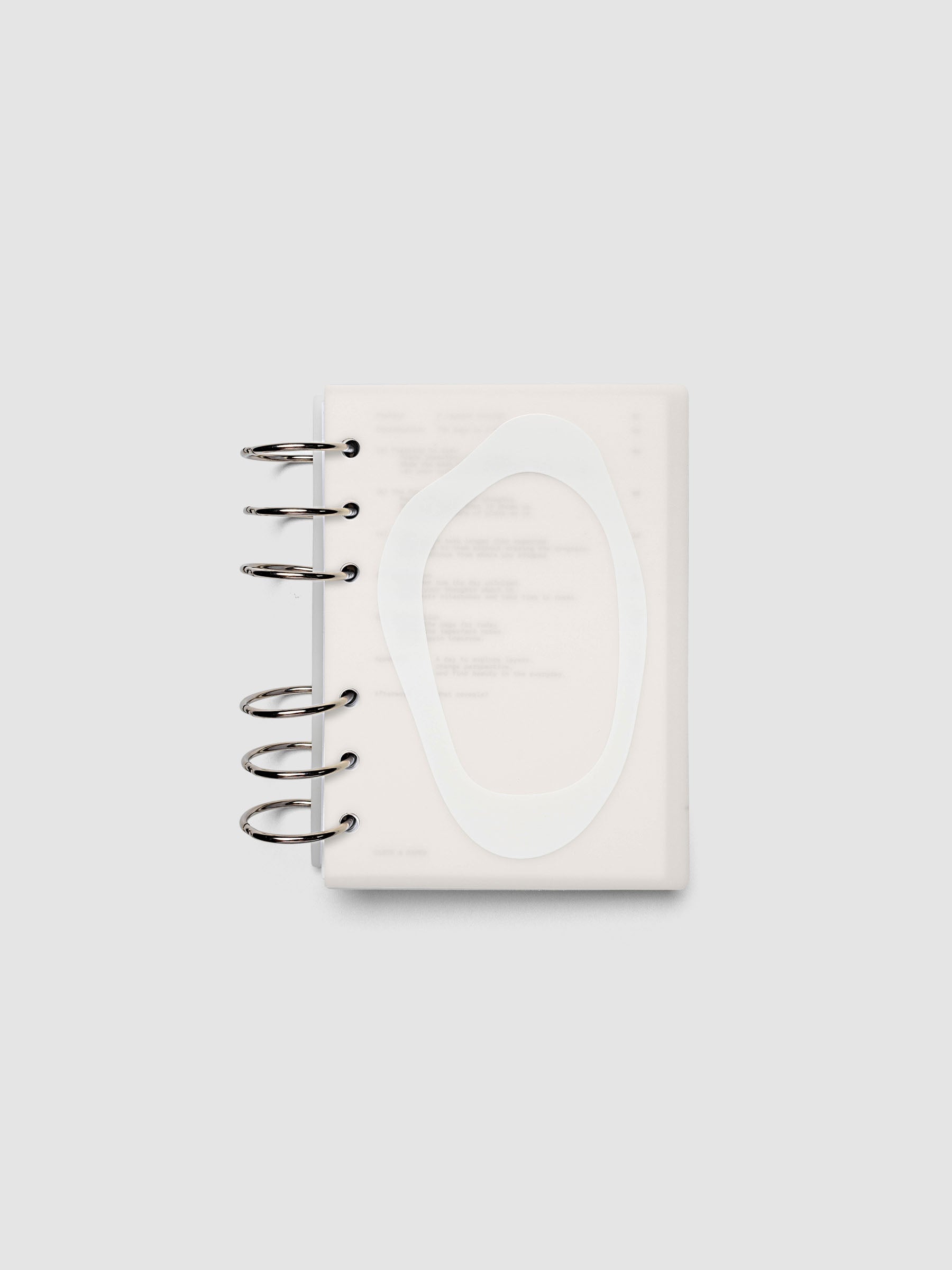 Continuation Planner Cover + Dashboard Set in A6. Milky white frosted plastic cover with a spot gloss organic shape over a black-printed paper dashboard. Image 2 of 3.