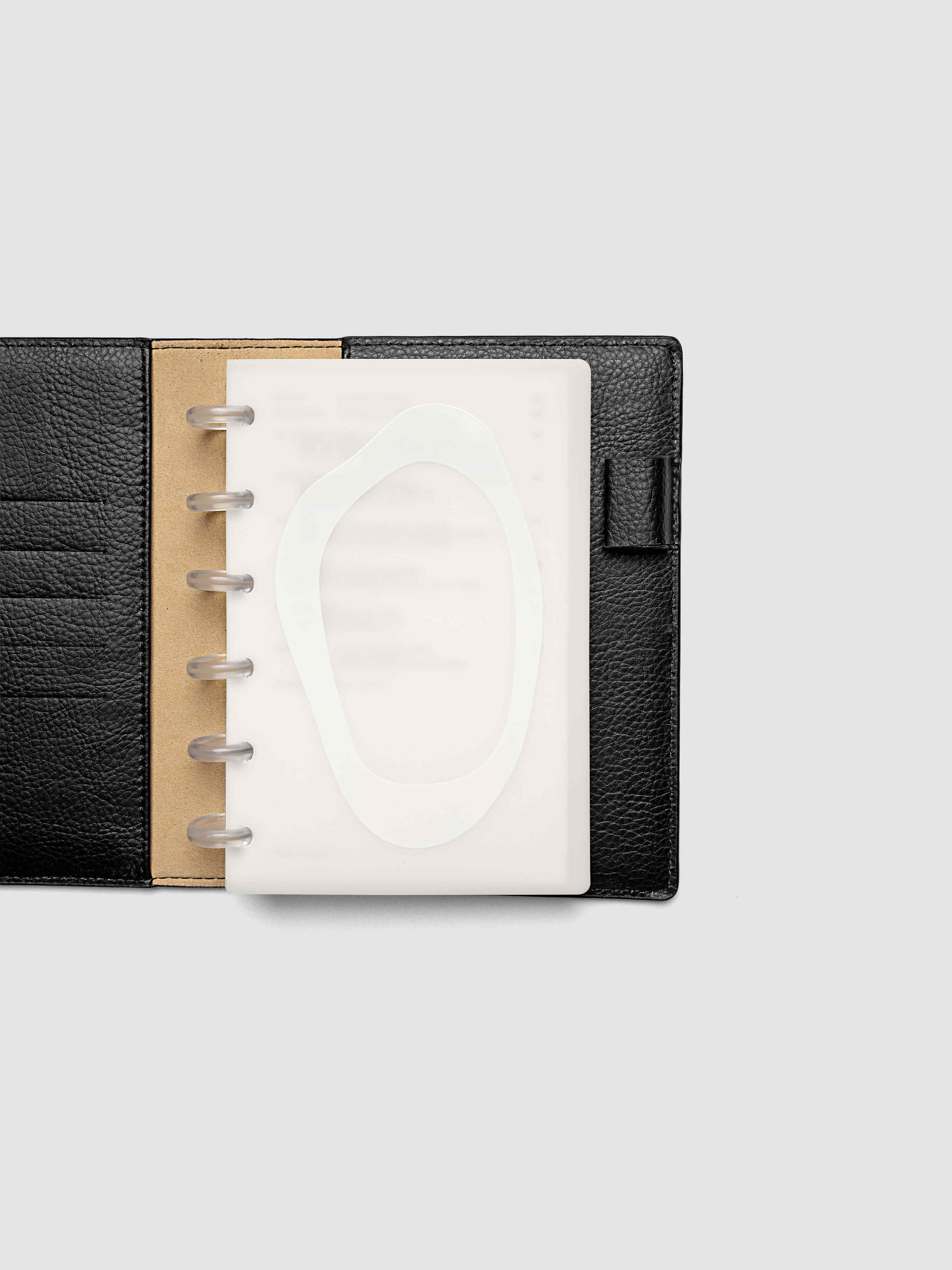 Continuation Planner Cover + Dashboard Set in CP Petite. Milky white frosted plastic cover with a spot gloss organic shape over a black-printed paper dashboard. Image 2 of 3.