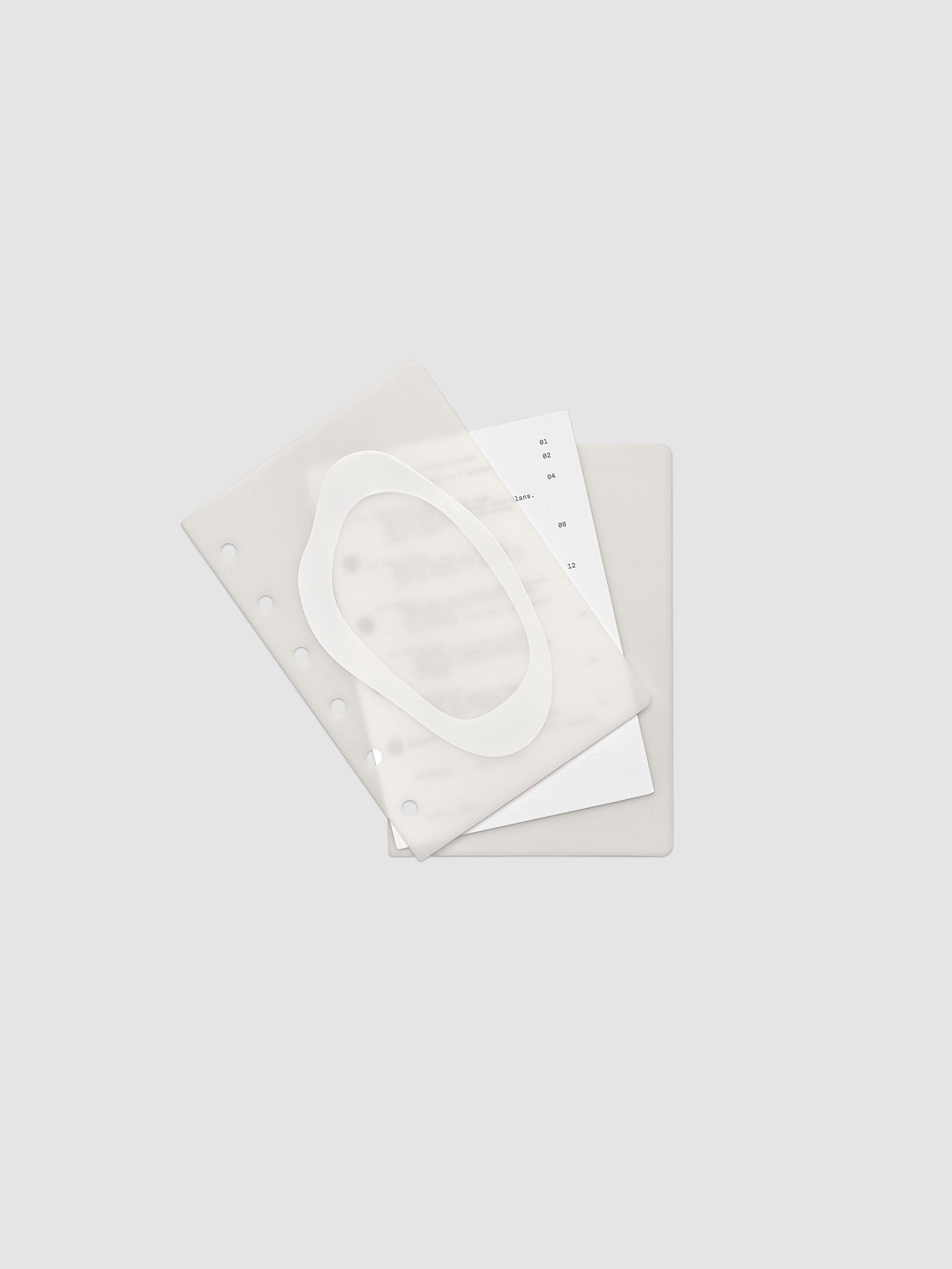 Continuation Planner Cover + Dashboard Set in Pocket. Milky white frosted plastic cover with a spot gloss organic shape over a black-printed paper dashboard. Image 2 of 3.