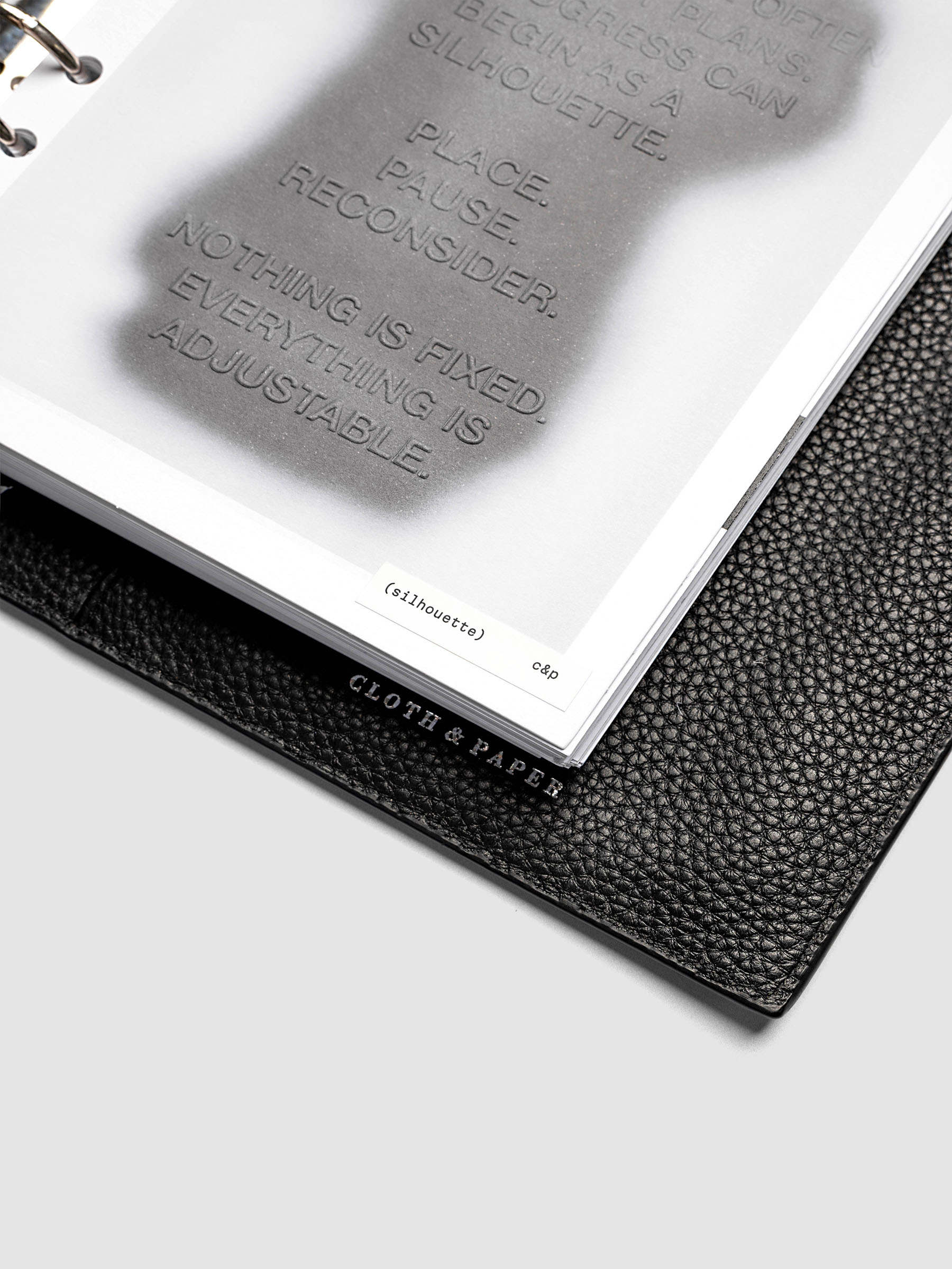Silhouette Planner Dashboard in A5 6-Ring Punch. Greyscale silhouette print with embossed text on paper. Image 3 of 4.