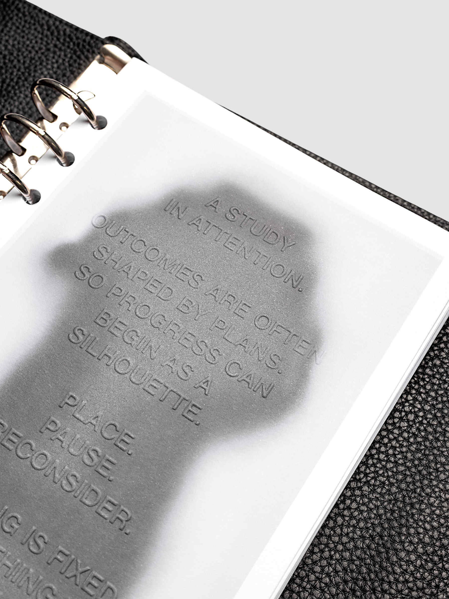 Silhouette Planner Dashboard in A5 6-Ring Punch. Greyscale silhouette print with embossed text on paper. Image 4 of 4.