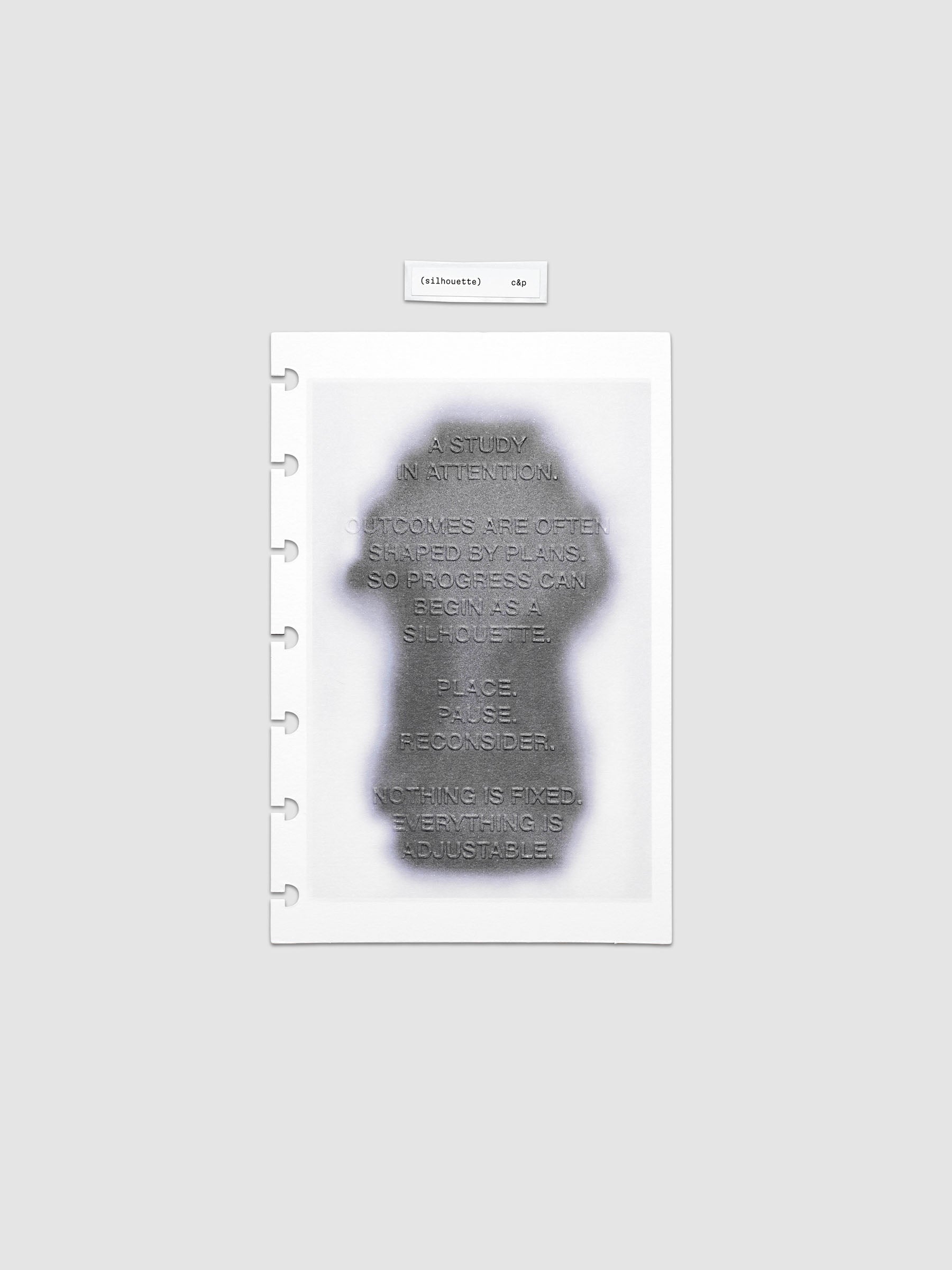 Silhouette Planner Dashboard in HP Mini. Greyscale silhouette print with embossed text on paper. Image 1 of 1.