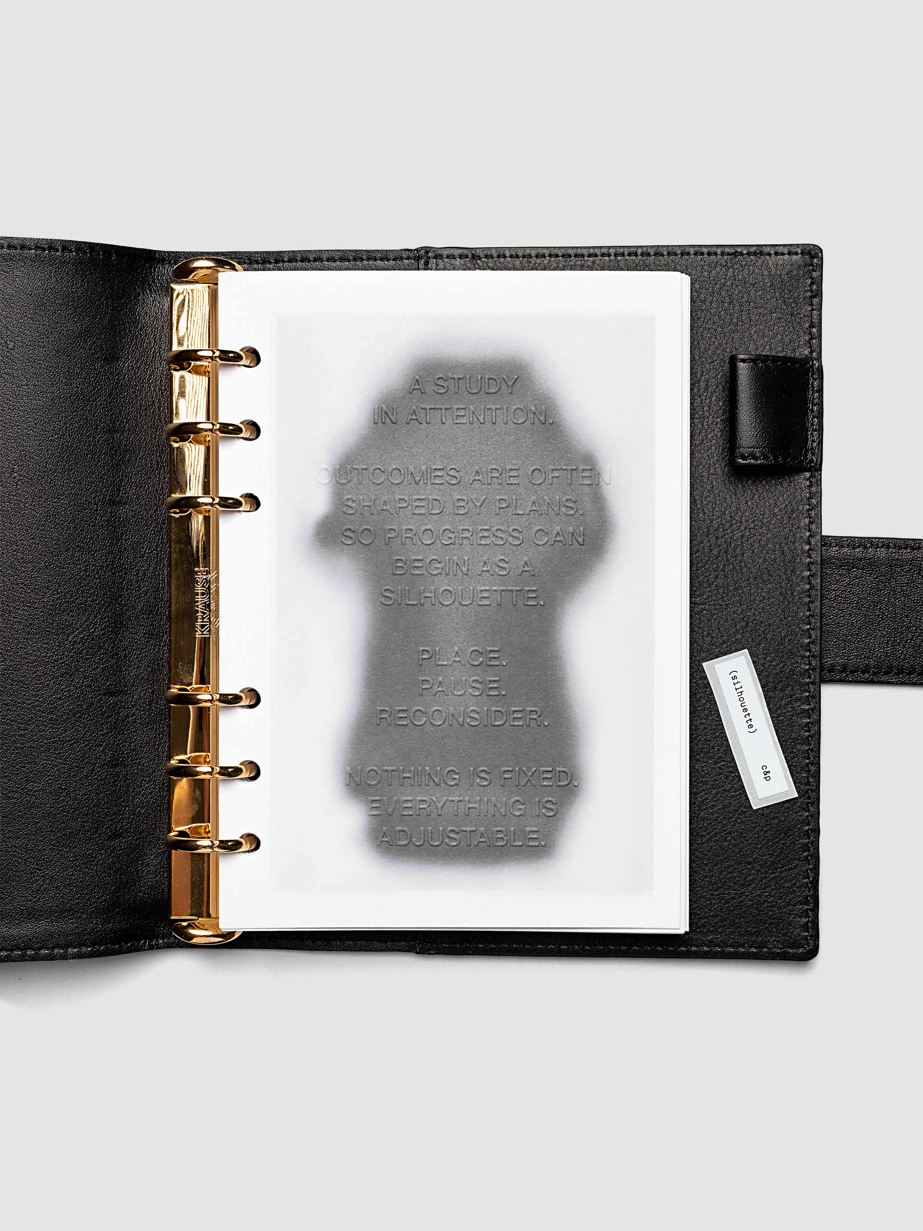 Silhouette Planner Dashboard in Personal Wide. Greyscale silhouette print with embossed text on paper. Image 2 of 2.