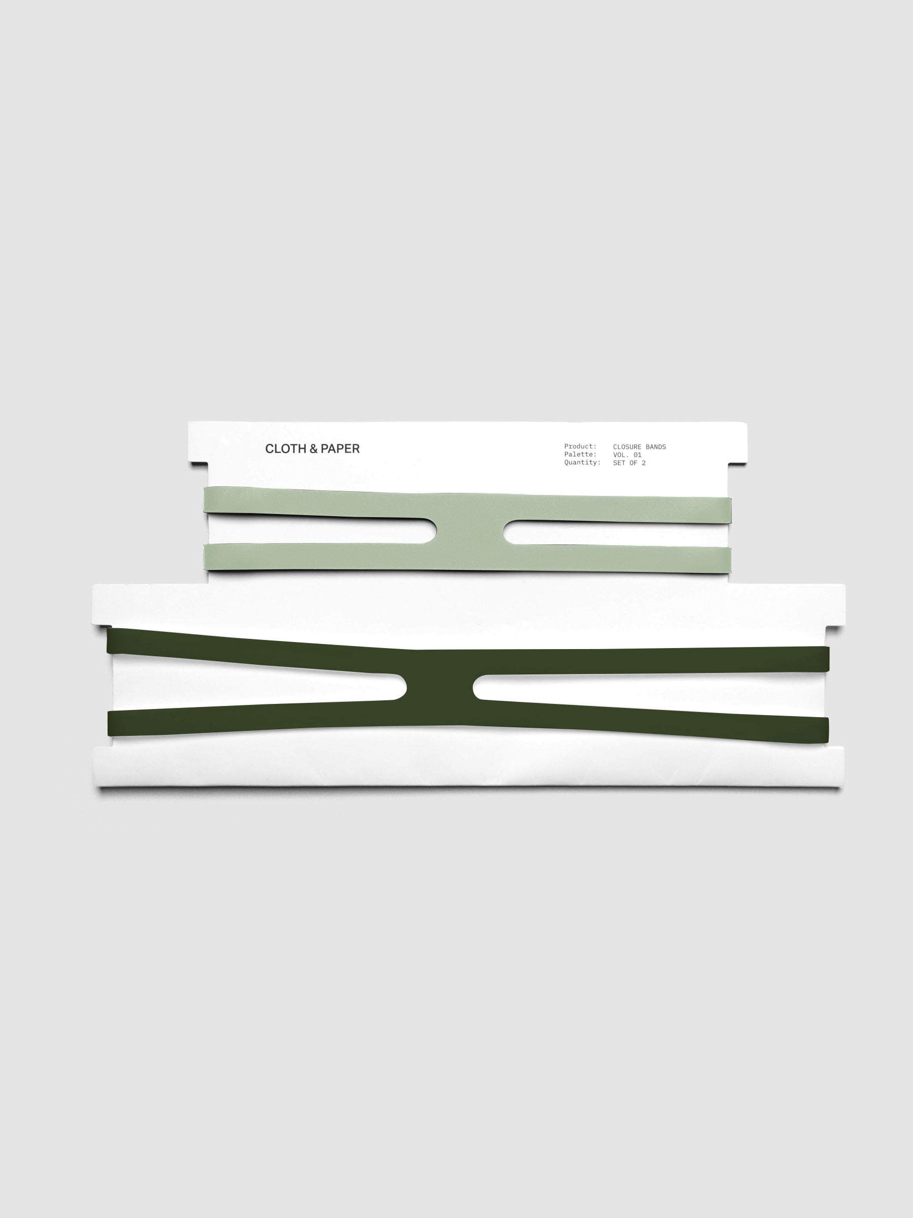 Matcha and Olive planner closure bands shown on their packaging cards, small matcha band above and large olive band below.