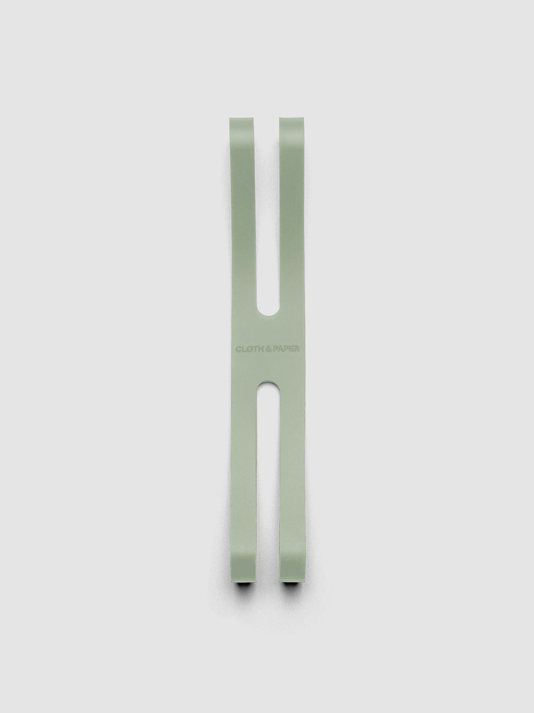 Small matcha planner closure band shown flat on a grey background.