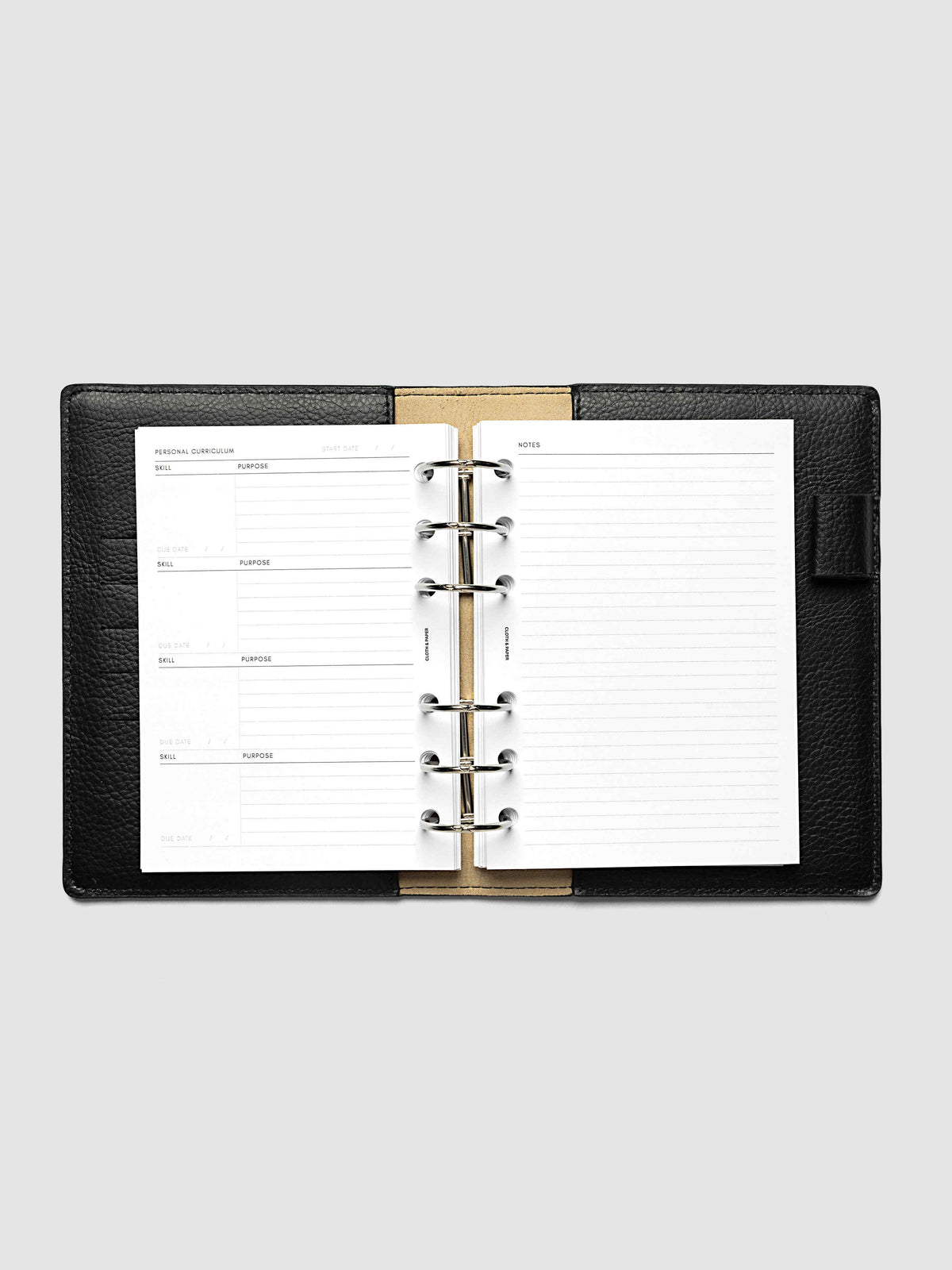 The A6 Personal Curriculum Planner Inserts open in a black leather ring bound planner to the index spread, four skill entries with purpose and due date on the left and a lined notes page on the right
