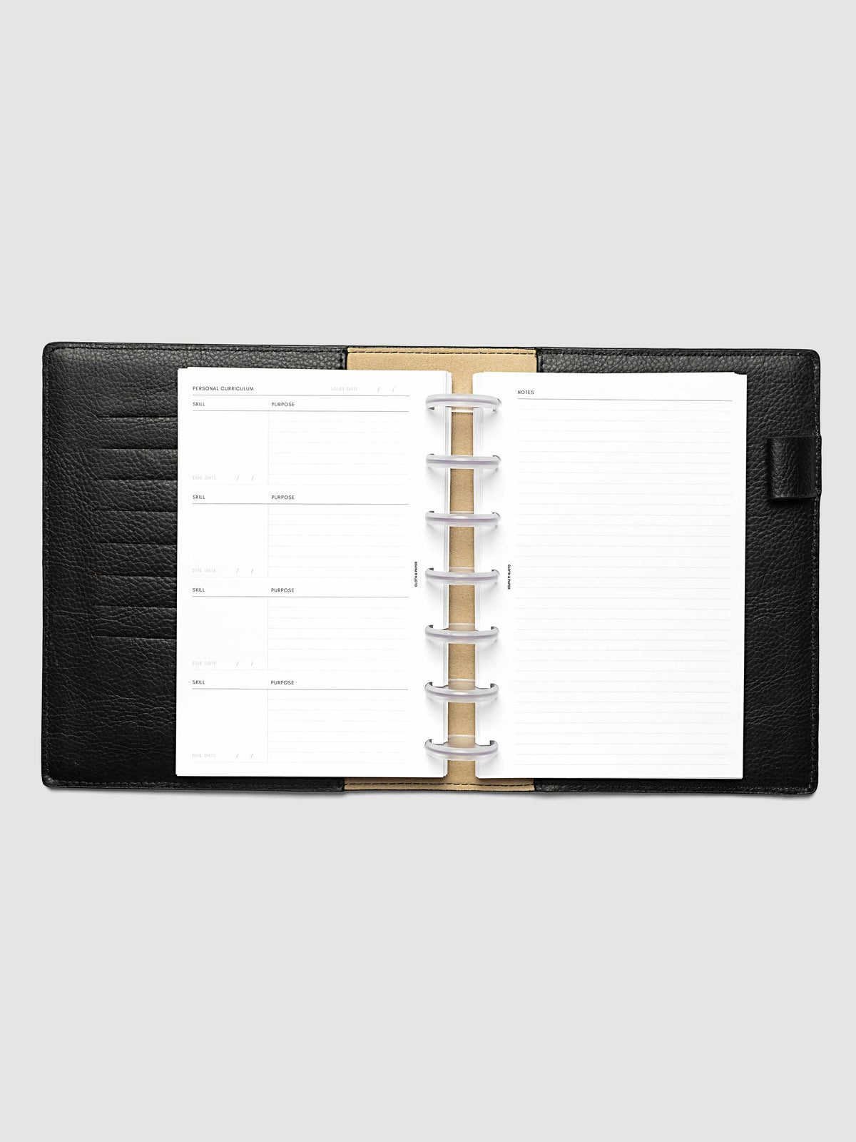 The HP Mini Personal Curriculum Planner Inserts open in a black leather ring bound planner to the index spread, four skill entries with purpose and due date on the left and a lined notes page on the right