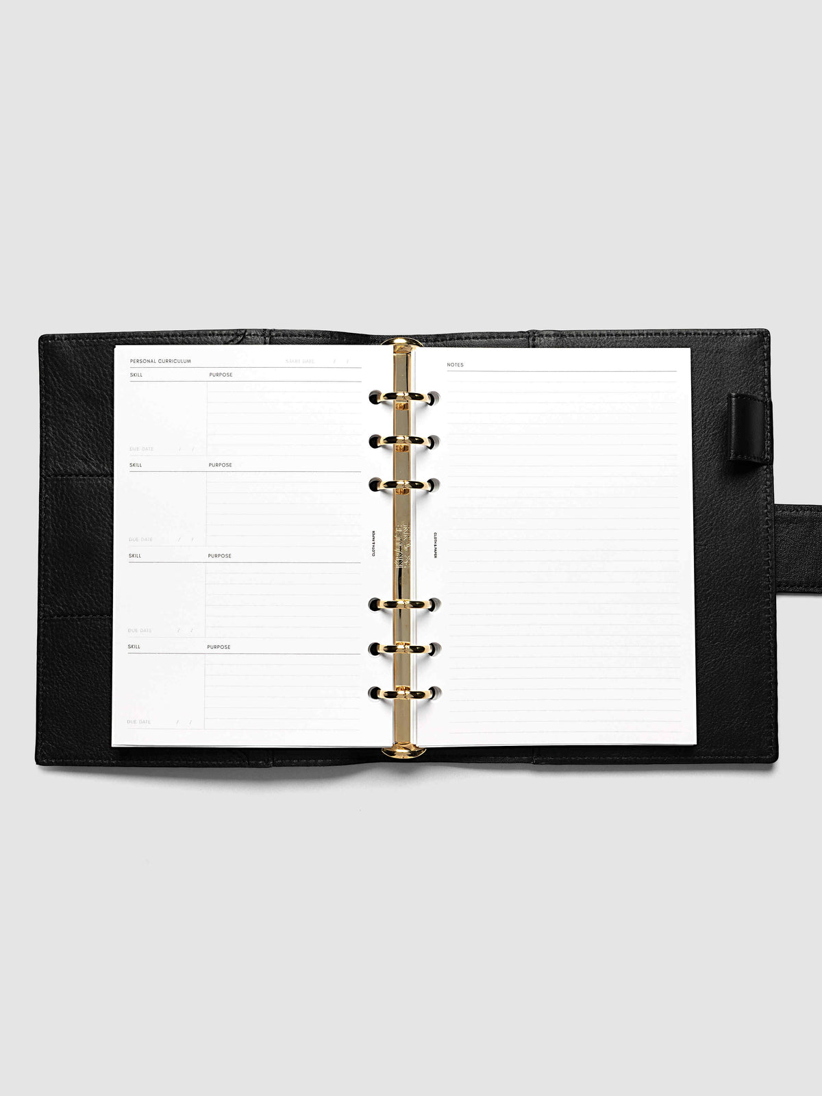 The Personal Wide Personal Curriculum Planner Inserts open in a black leather ring bound planner to the index spread, four skill entries with purpose and due date on the left and a lined notes page on the right