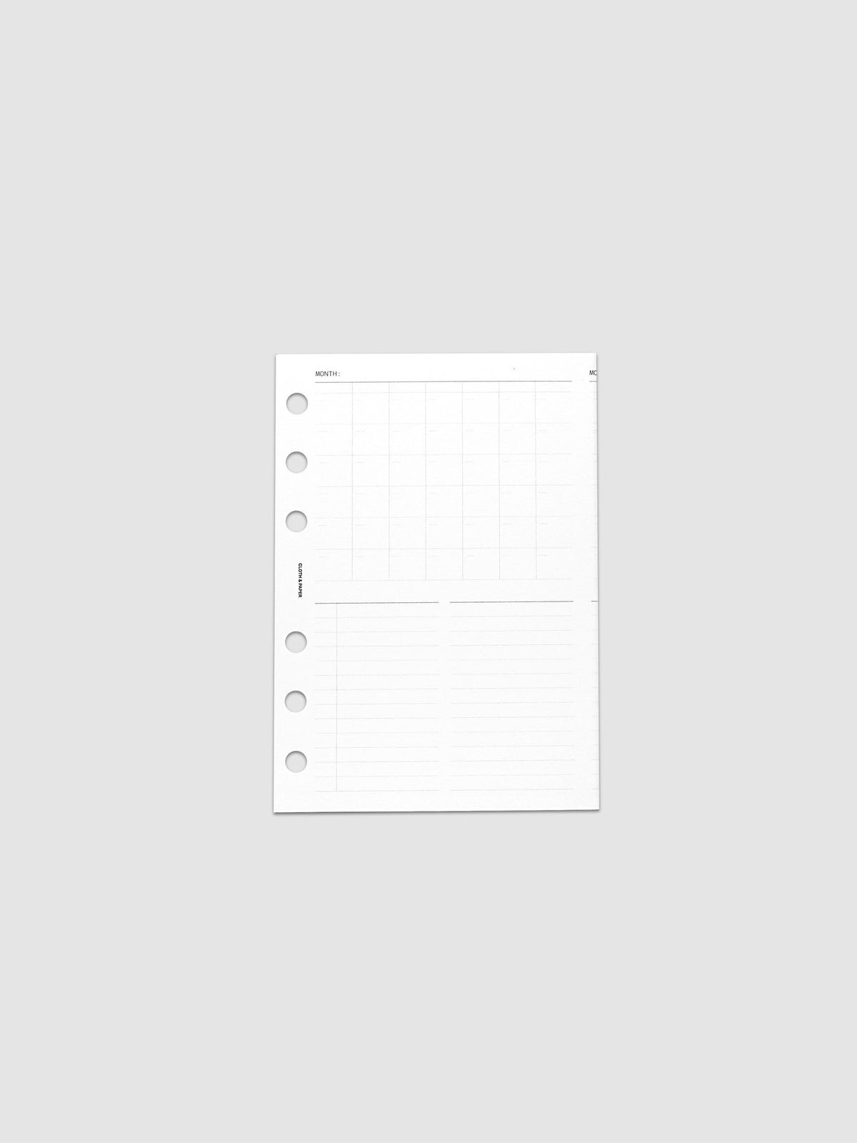 Monthly Fold Out Planner Insert Set of 2, A6 6-Ring Punch, a single white insert folded closed and centered flat in frame, six round punch holes along the left edge