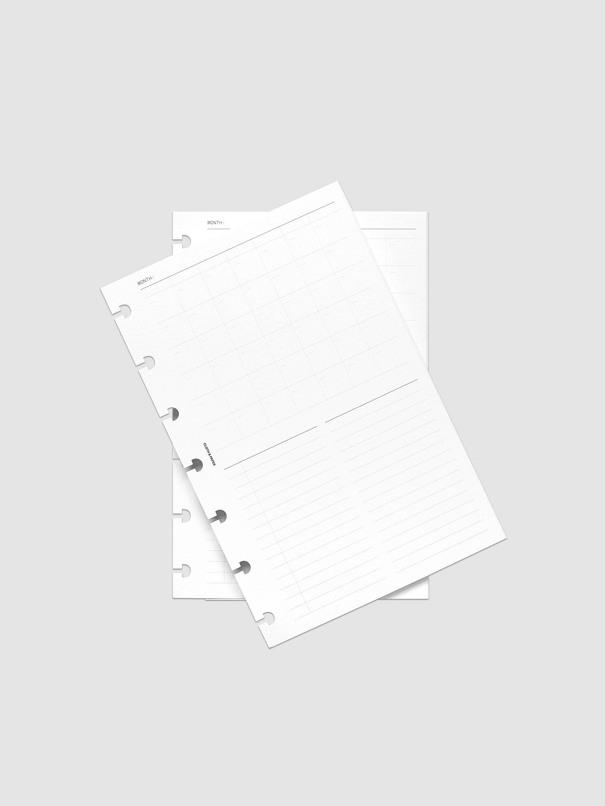 Monthly Fold Out Planner Insert Set of 2, HP Mini 7-Disc Punch, both inserts of the set overlapping at an angle, gray grid and lined note printing visible on the top sheet