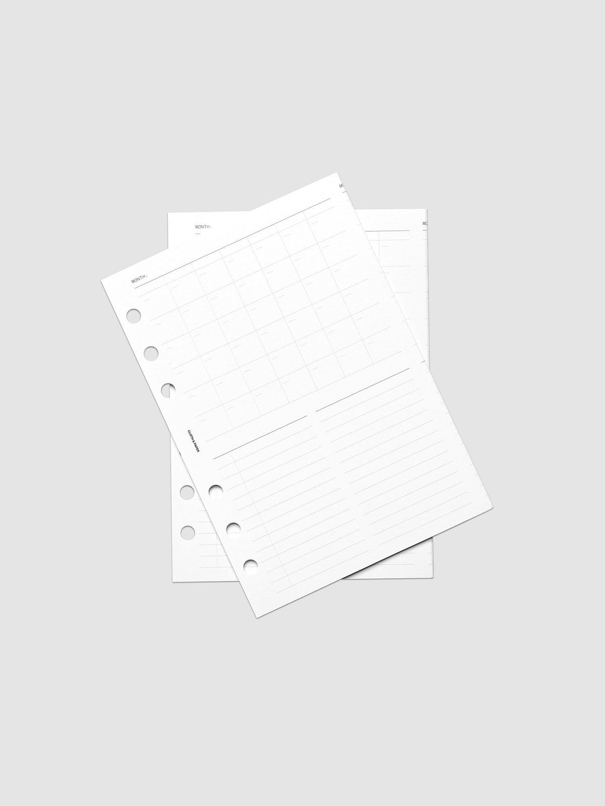 Monthly Fold Out Planner Insert Set of 2, Personal Wide 6-Ring Punch, both inserts of the set overlapping at an angle, round punch holes visible on each