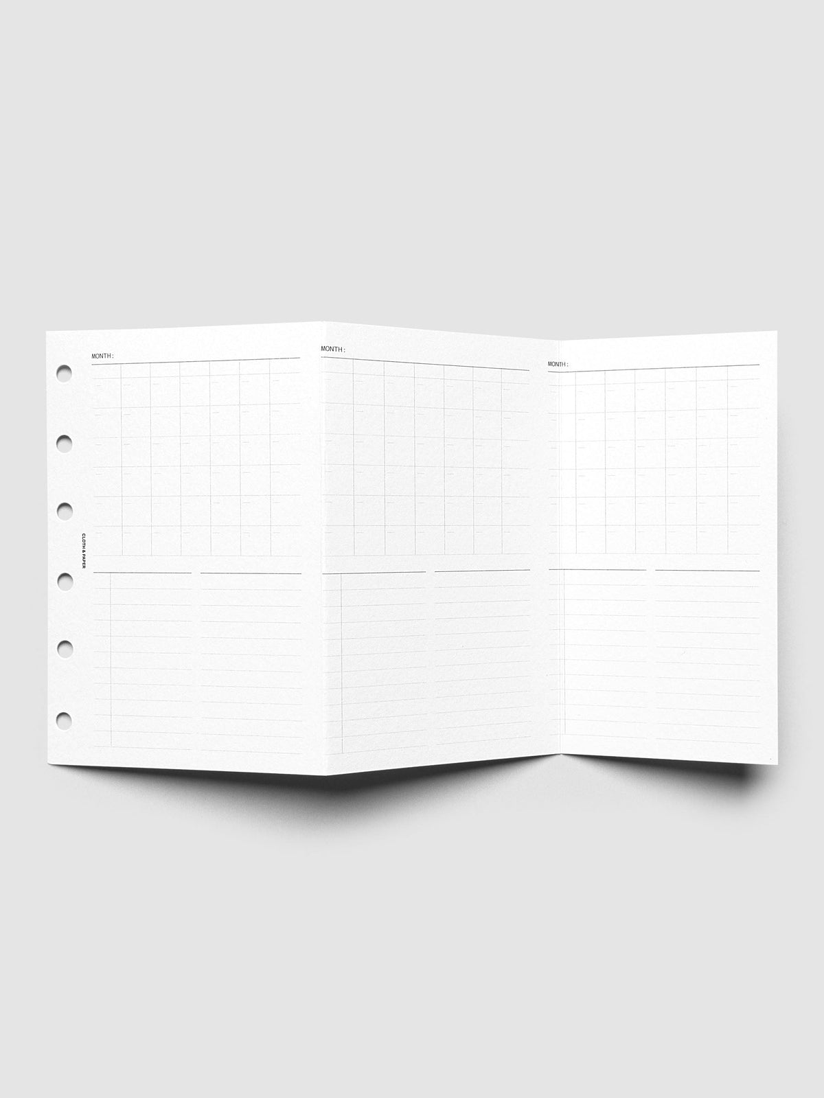 Monthly Fold Out Planner Insert Set of 2, Pocket 6-Ring Punch, the insert unfolded and standing open, three monthly grid panels above lined note sections