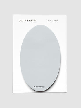 Oval Sticky Notes | Aspen shown from above, one pale blue gray oval pad mounted on a white backing card printed in black with the brand name and colorway