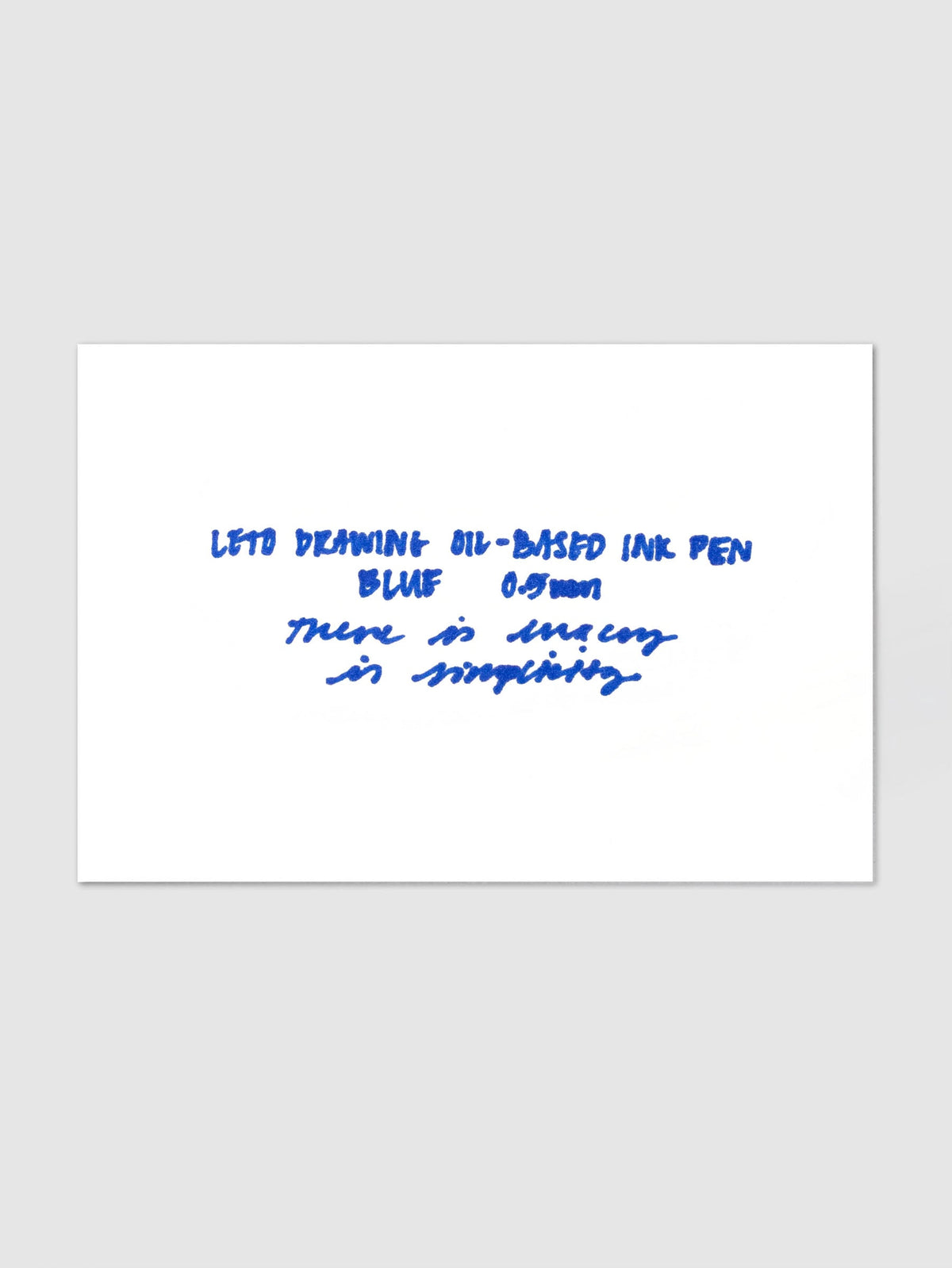 Leto Drawing Oil-Based Ink Pen, Blue | 0.5 mm, white card on a light gray background carrying a blue ink writing sample that names the pen and its tip size in print and script