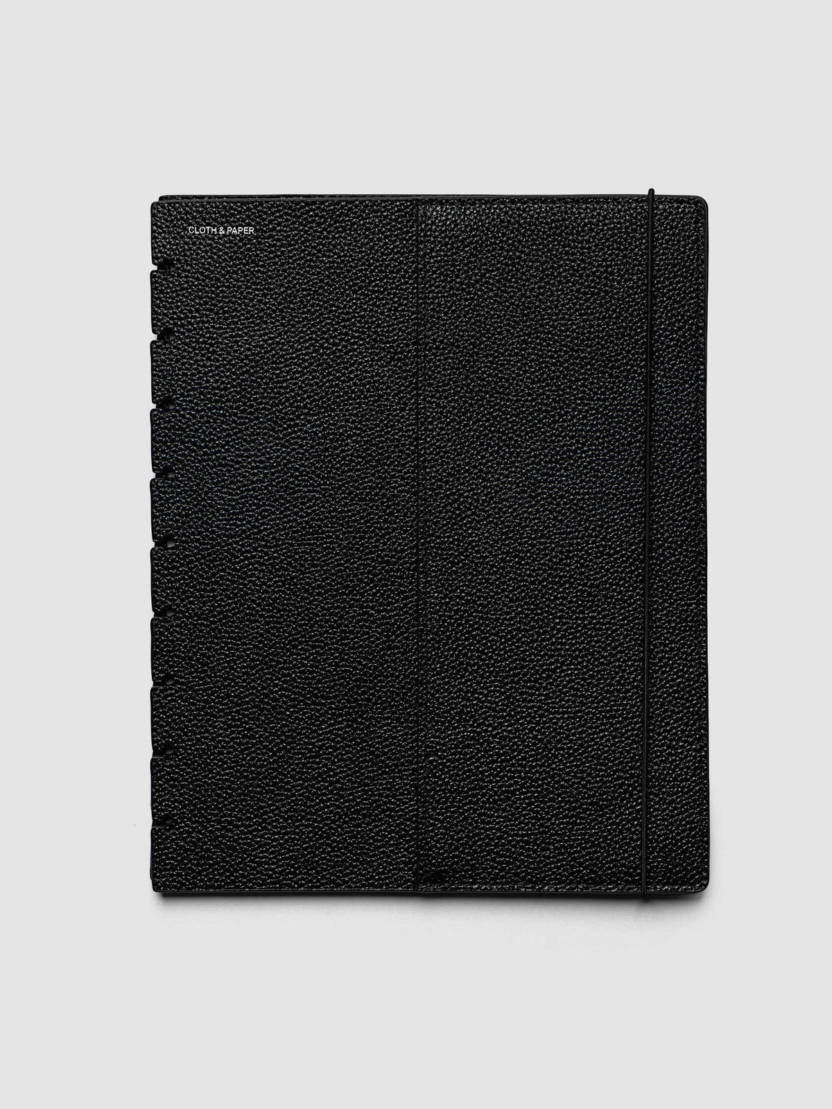 The front cover of the HP Classic 9-Disc Punch Genuine Leather Planner Cover Set laid flat, showing pebbled black leather, the silver foiled logo at the top left, the punch holes down the left edge, and the bungee cord running down the right