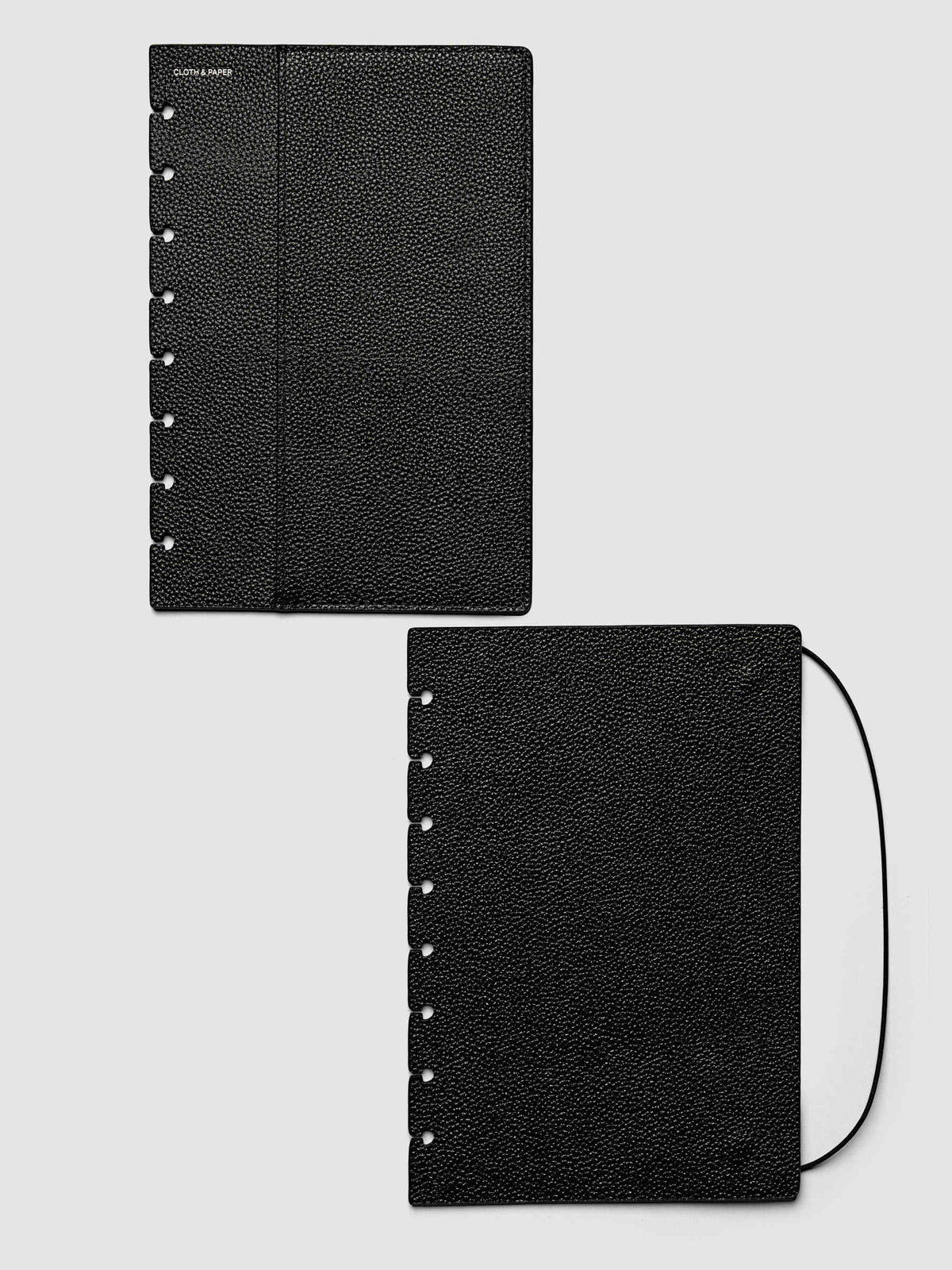 Both covers of the Half Letter 8-Disc Punch Genuine Leather Planner Cover Set laid flat side by side, the front cover with its sewn pocket seam and the back cover with the bungee cord looping out from the edge