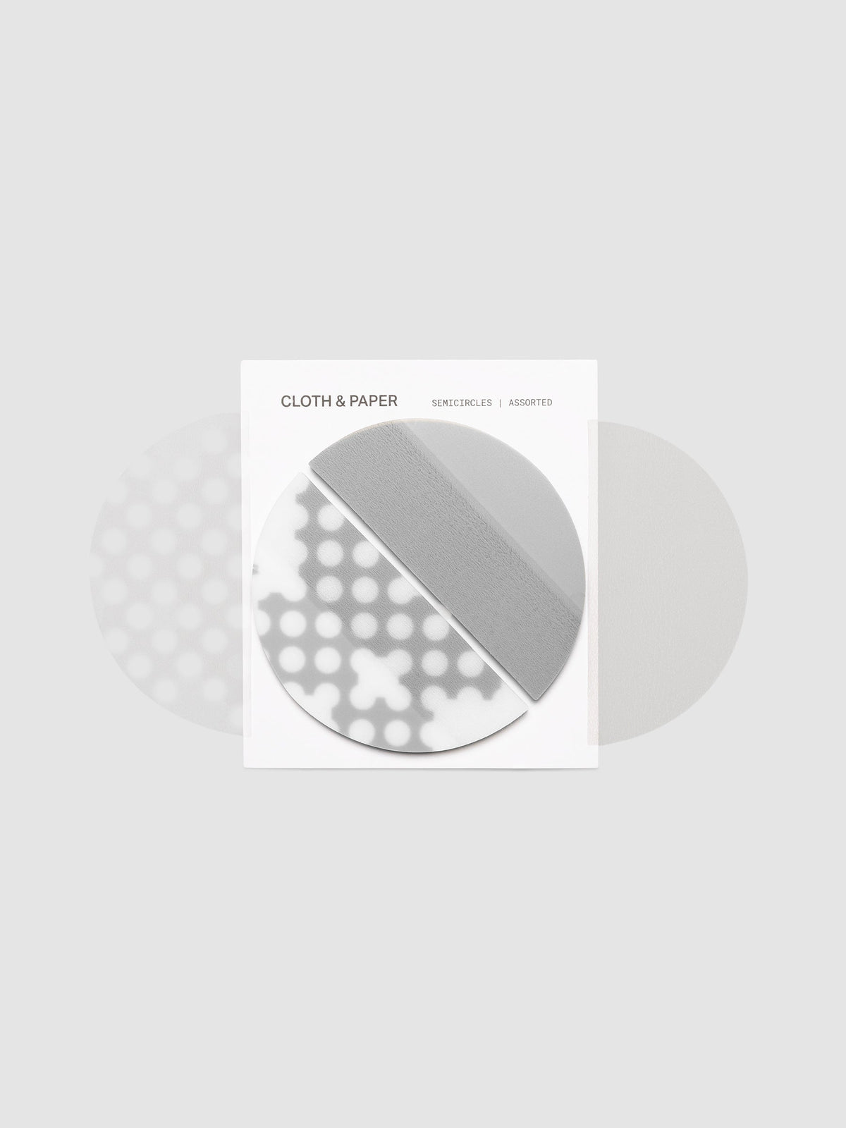 The Transparent Semicircle Sticky Notes on their backer card with two additional loose sheets fanned behind it, showing both designs