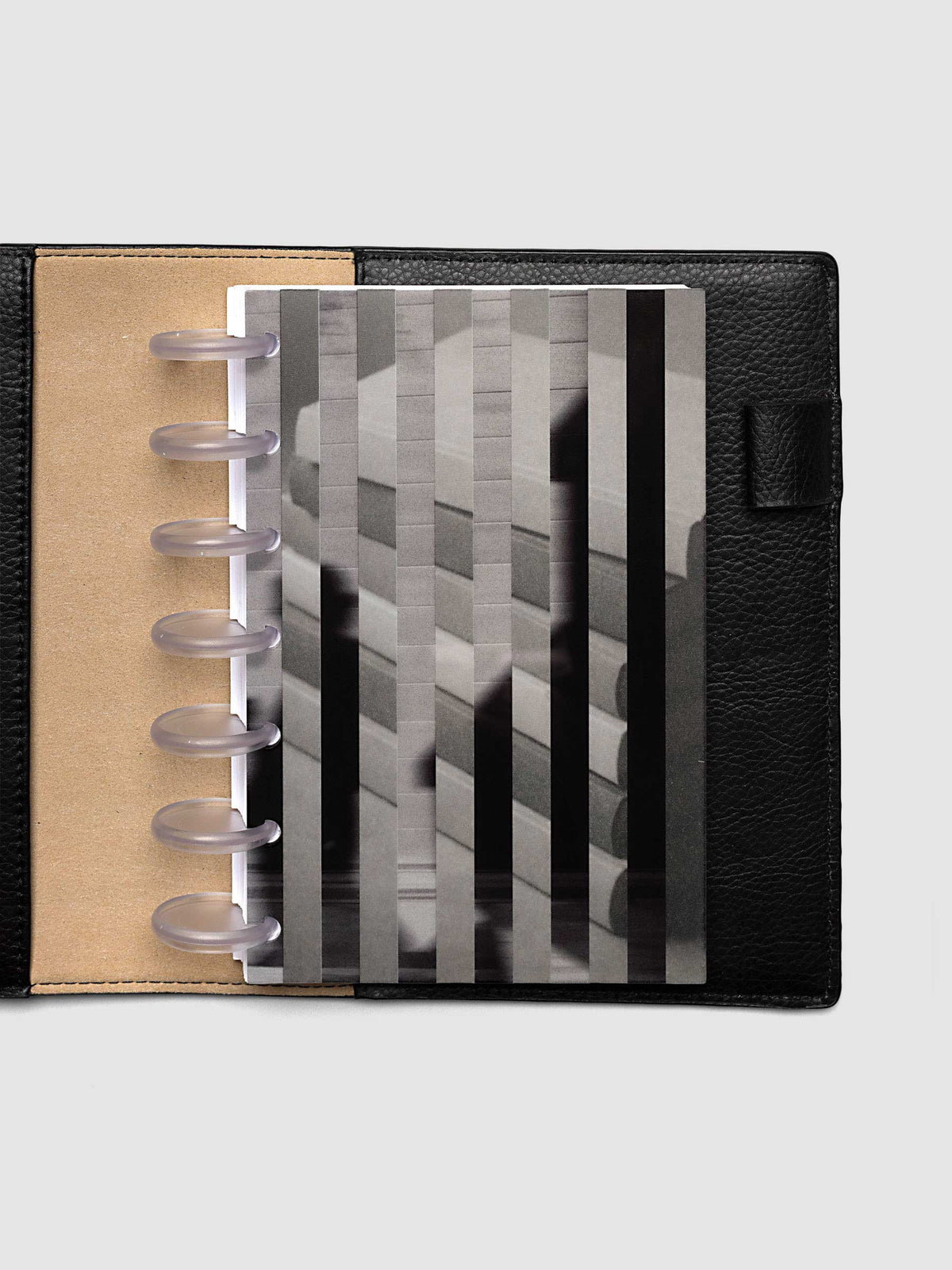 Both layers of the HP Mini Strips Planner Dashboard Duo overlapping, the clear plastic top layer of silhouettes in motion set across the vellum base layer of stacked books