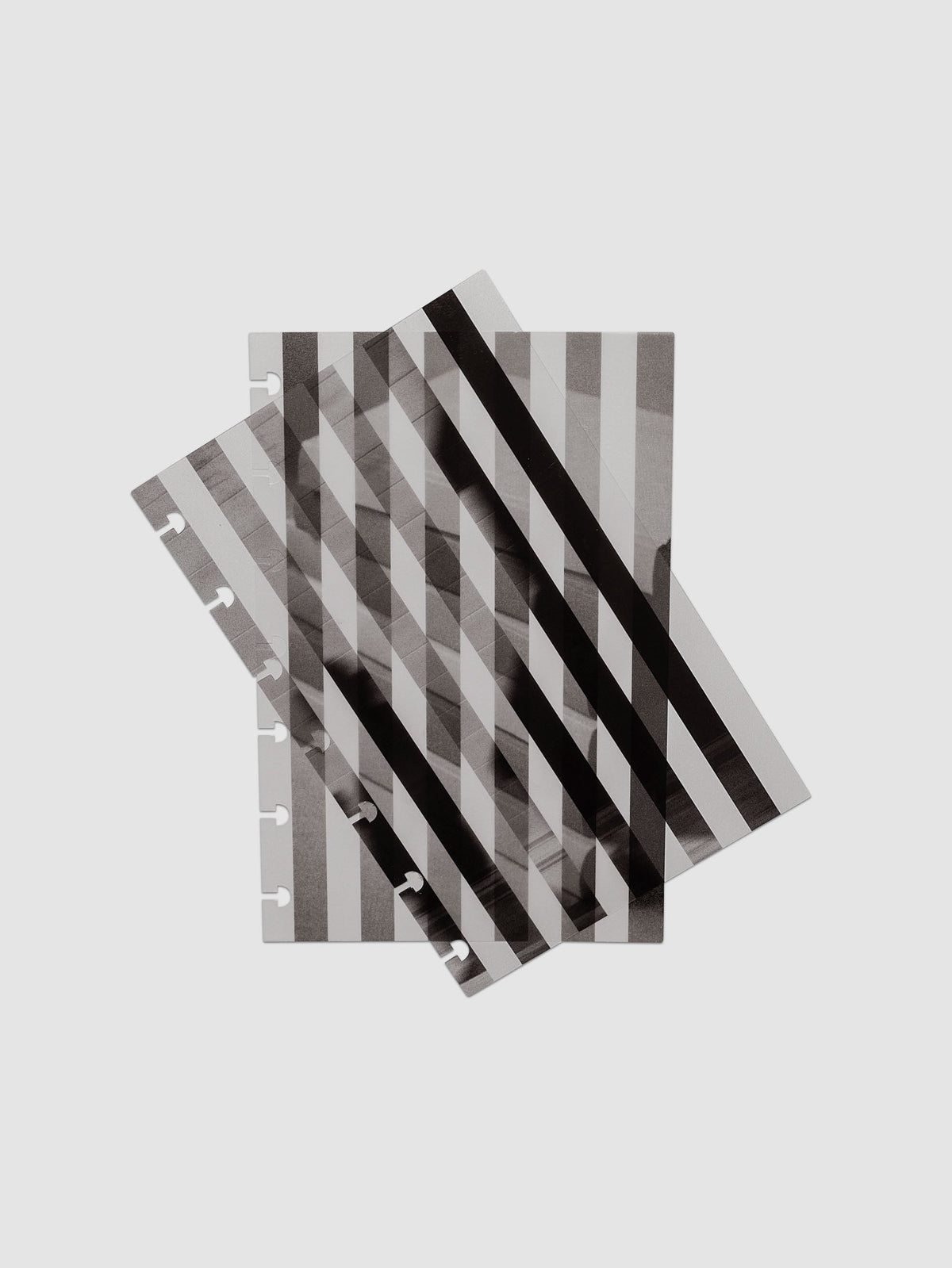 The HP Mini Strips Planner Dashboard Duo layered at the front of a black leather ring bound planner, both images combining into one striped picture
